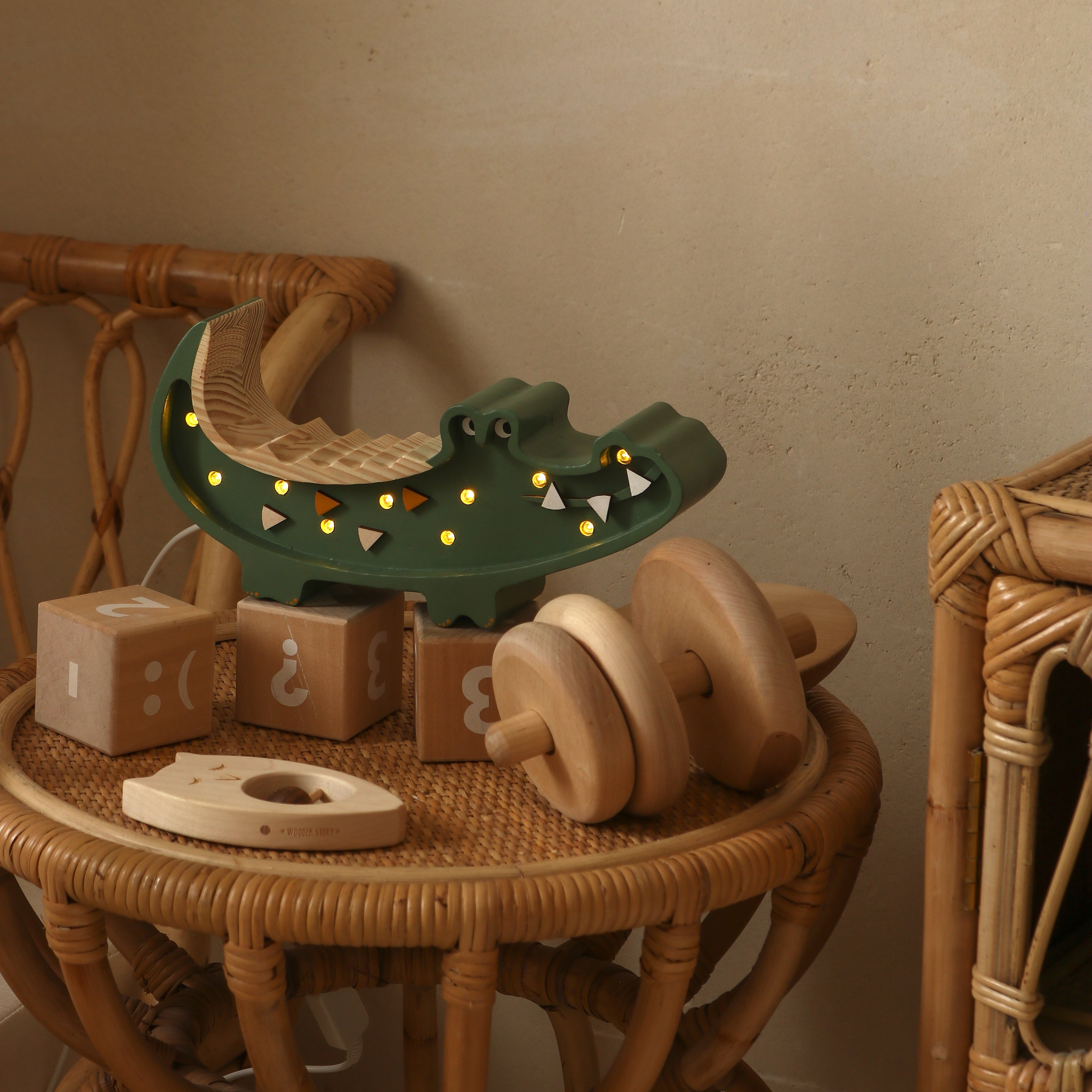 Military green wooden crocodile lamp with dimmer and remote control in a kids room