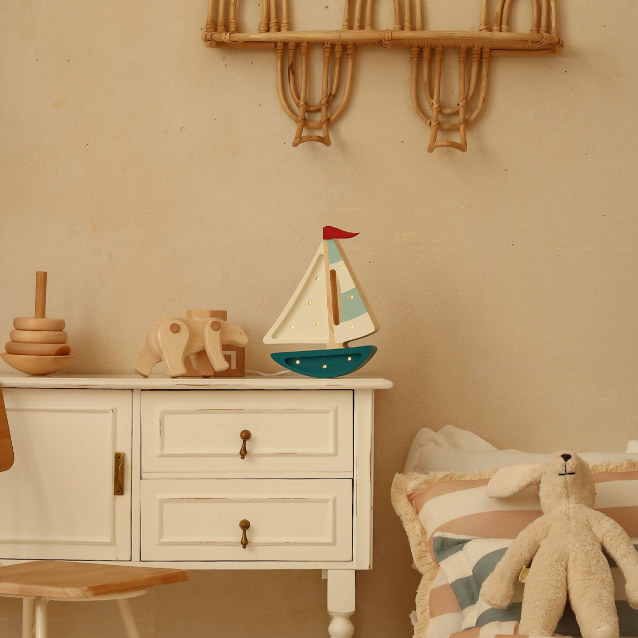 Teal Sailboat Lamp by the bed in a kid's room