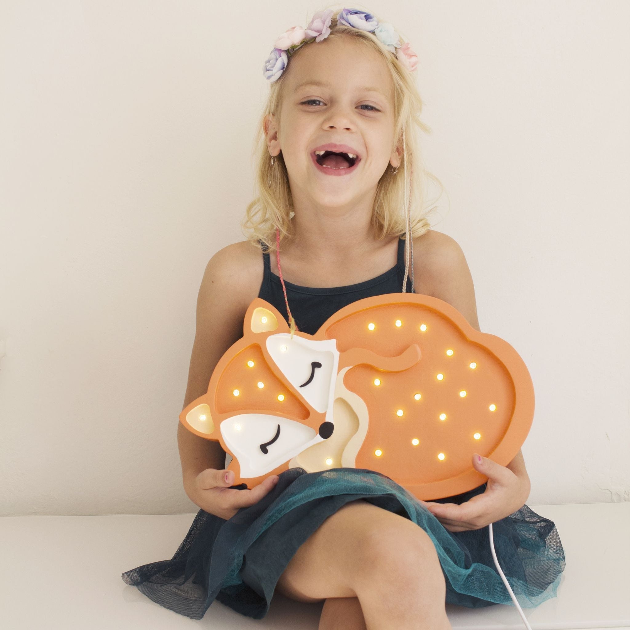 Girl holding Baby Fox Lamp