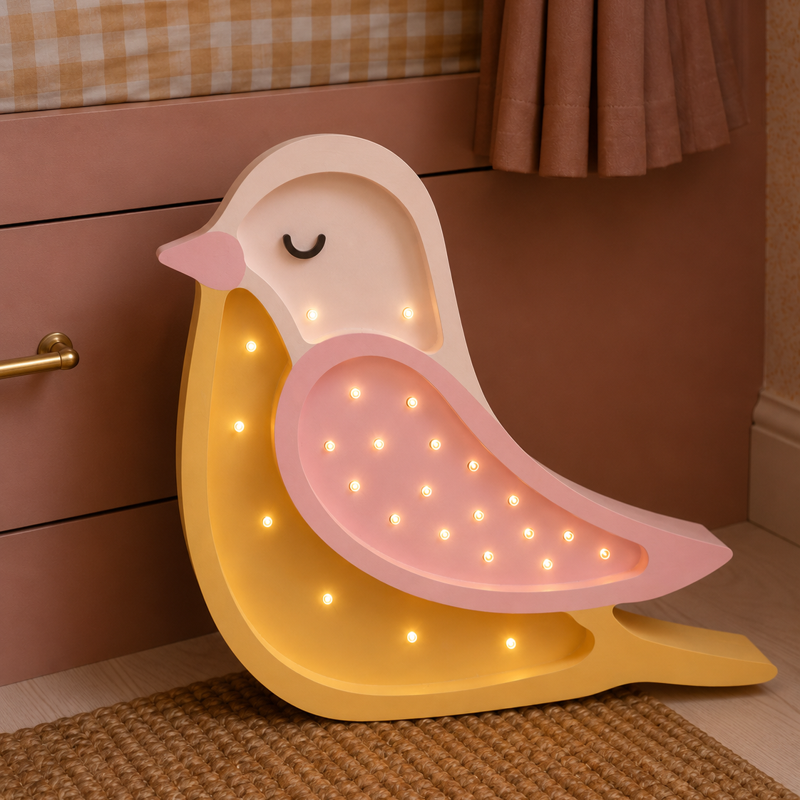 Little Lights pink Bird Night Light in a girl's room