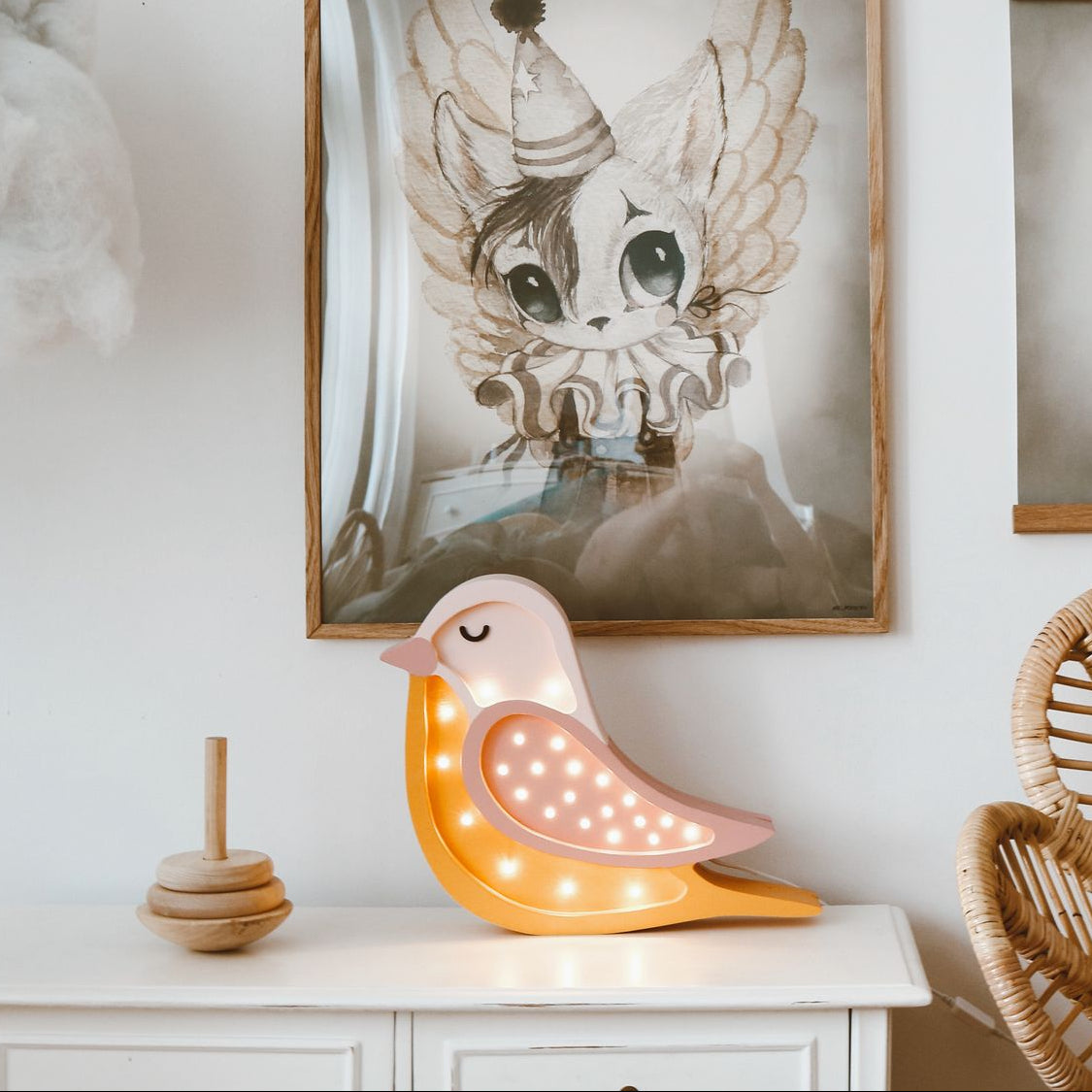 Wooden Bird night light on a dresser in kids room