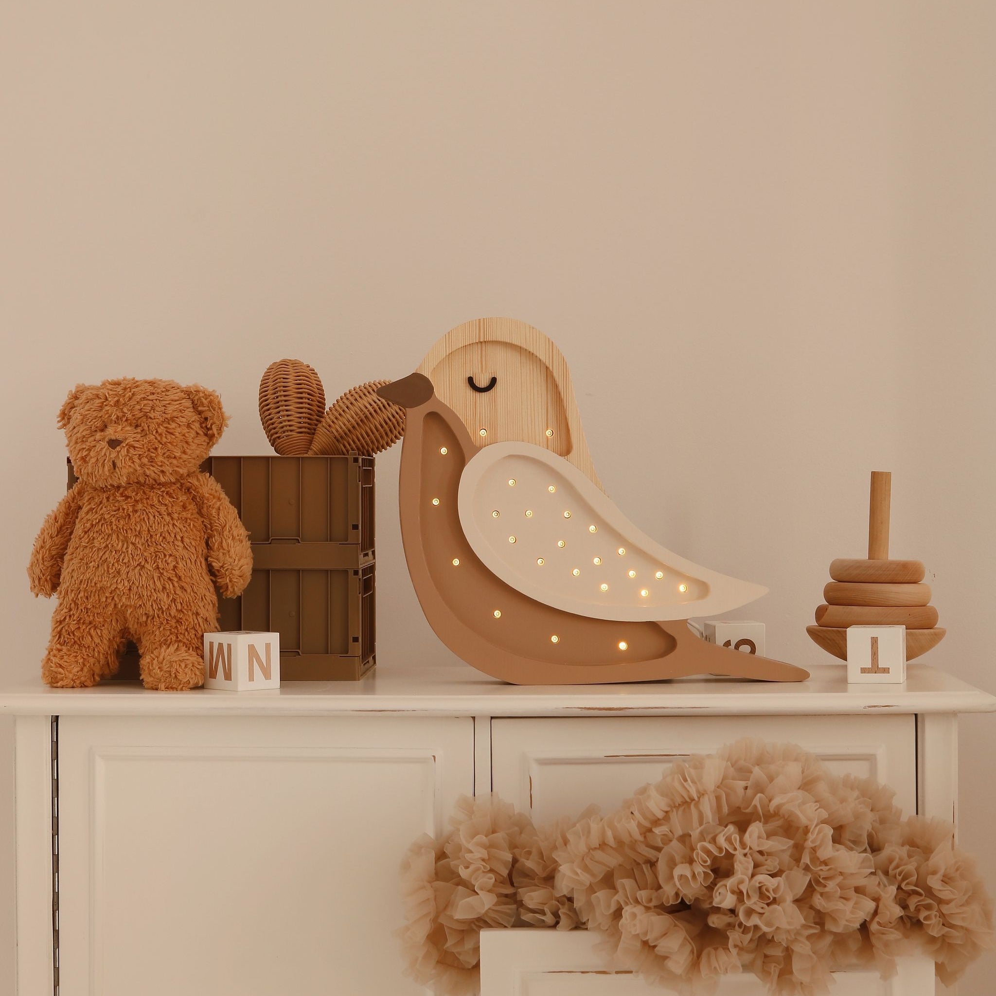Little Lights Bird Lamp on a dresser in a baby nursery