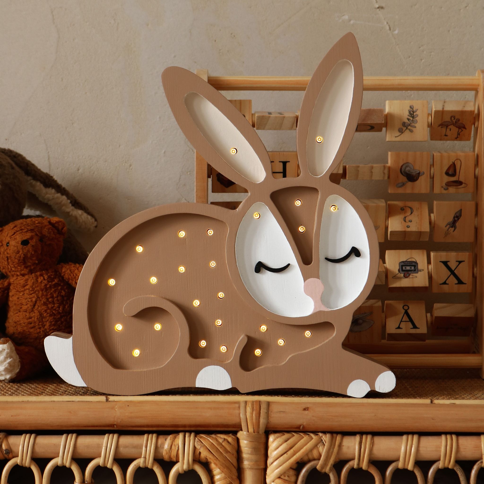 Little Lights wooden Bunny night light on a dresser in a kid's room