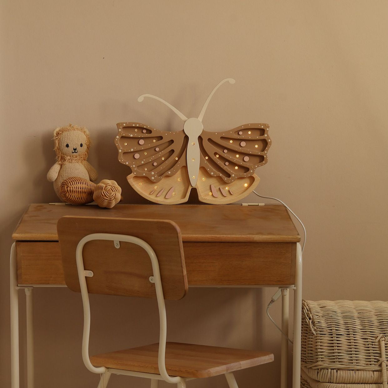 Little Lights Butterfly coffee cream lamp on the desk in a kid's room