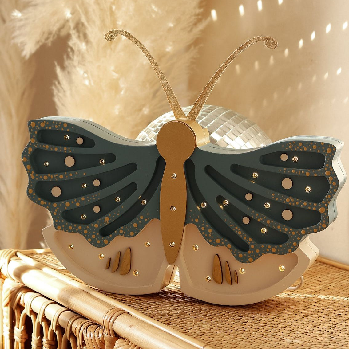 Little Lights Butterfly dimmable lamp glowing softly in a child's room
