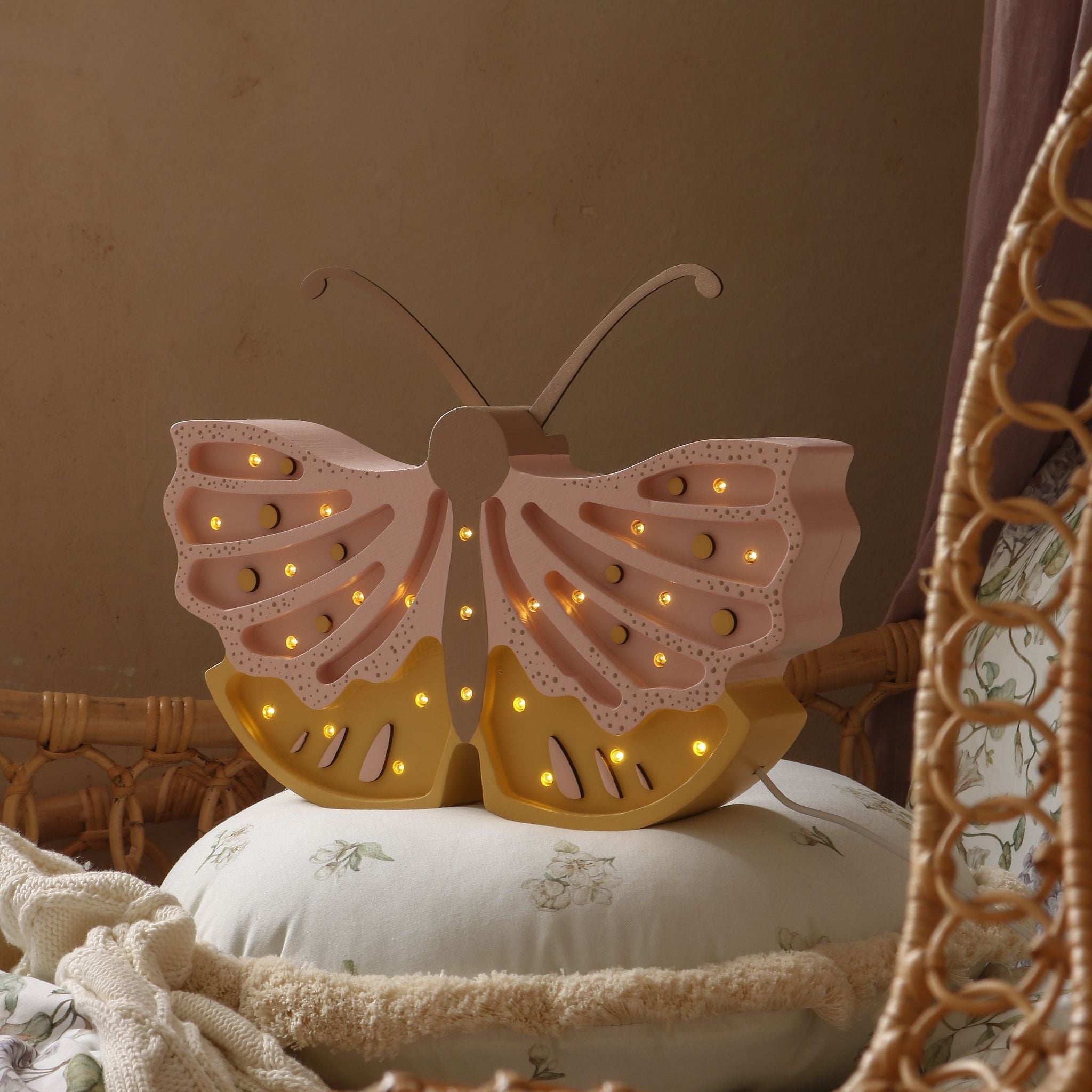 Little Lights Butterfly night light softly glowing in a kid's room