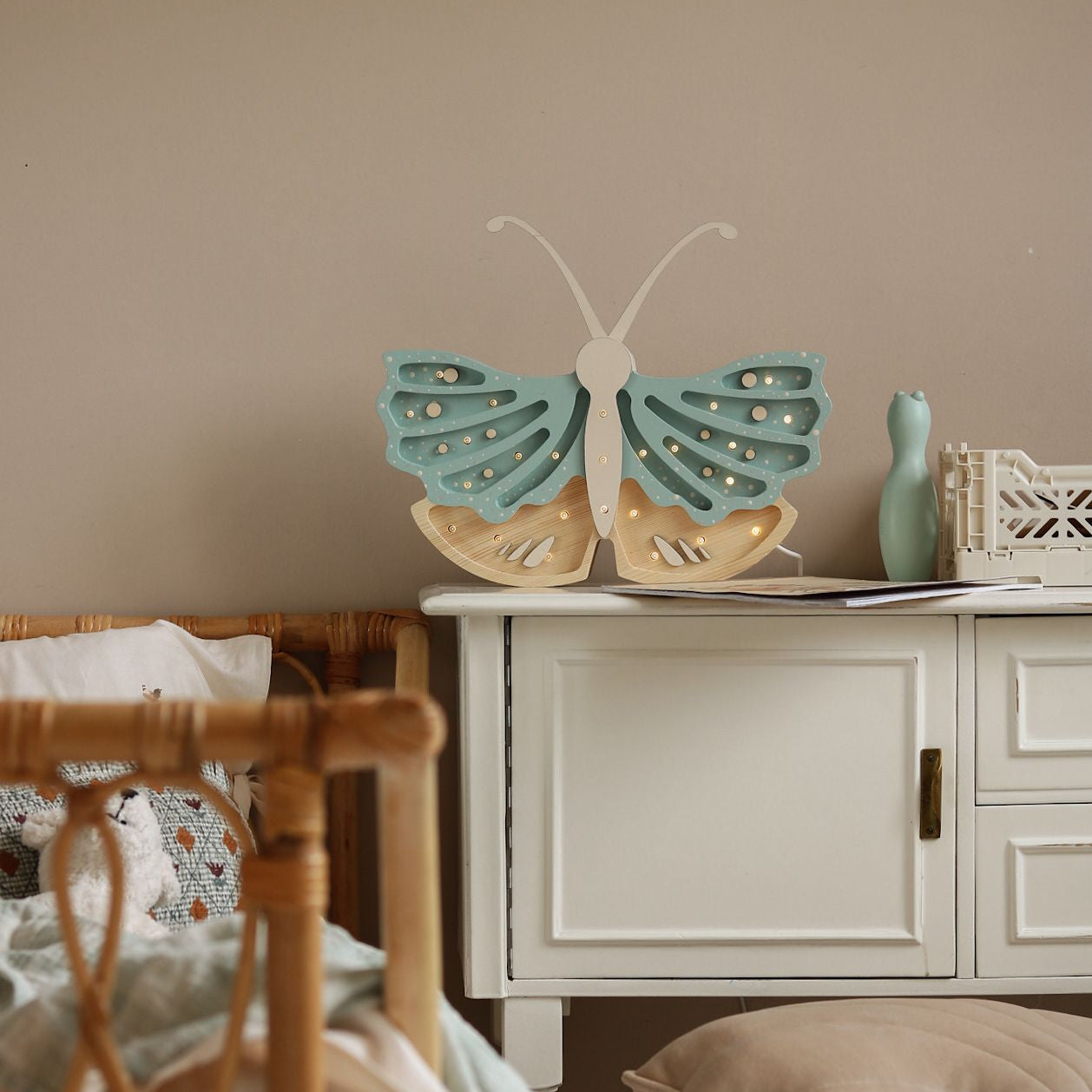 Little Lights Butterfly lamp in a on a dresser in a kid's room
