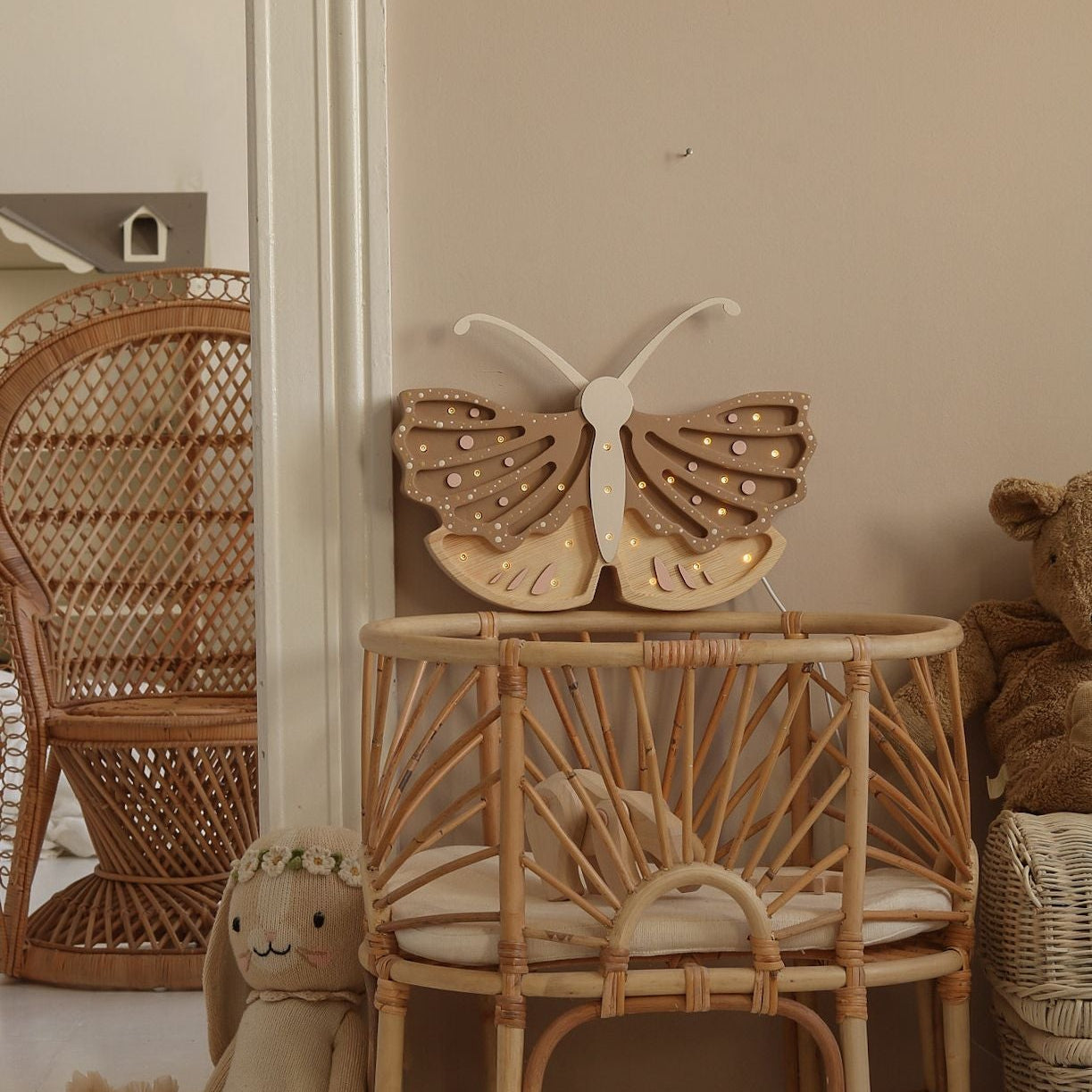 Little Lights beige Butterfly night light by the baby crib