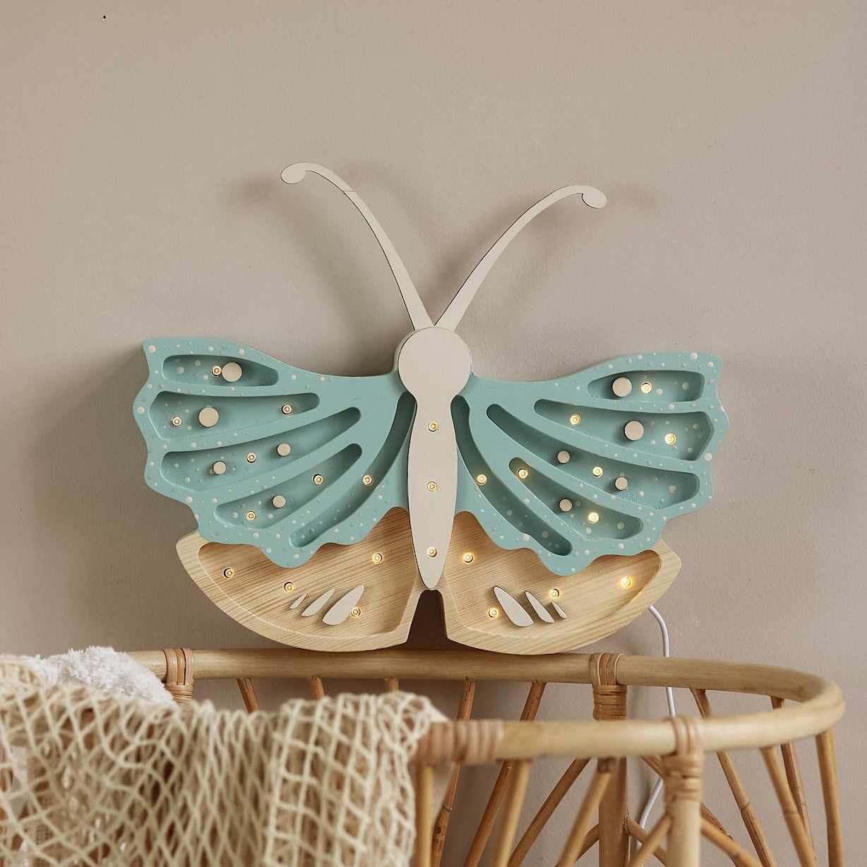 Little Lights Butterfly Lamp by the baby crib