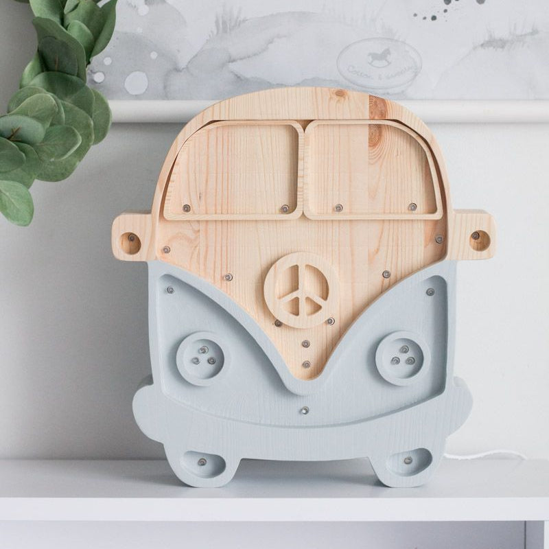 Little Lights Camper Van Lamp on a shelf in a child's room