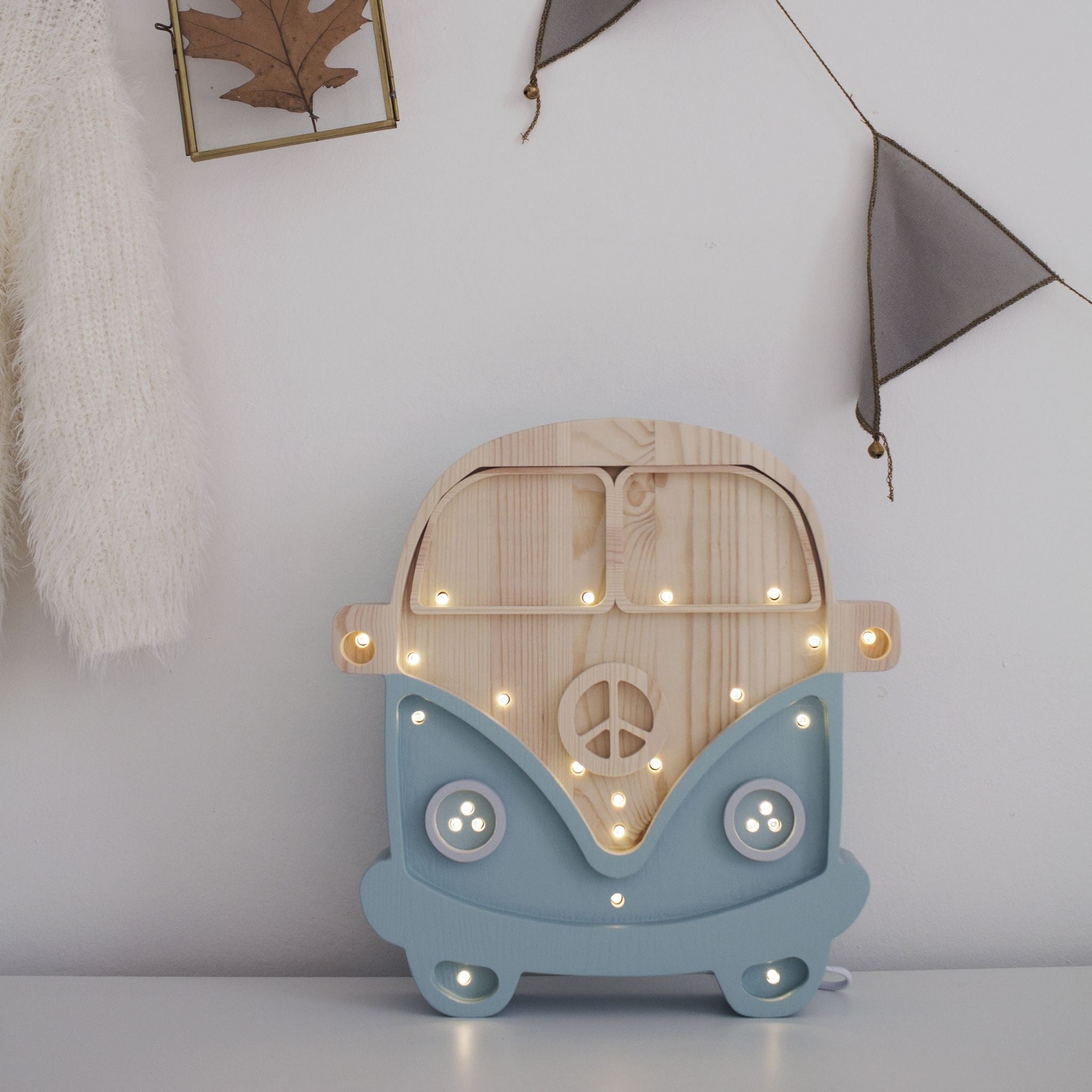 Little Lights Camper Van Lamp glowing in a kid's room