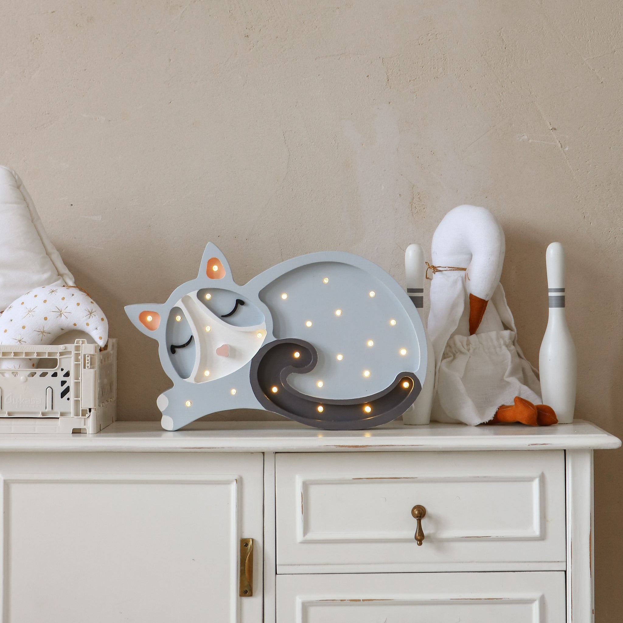 Little Lights Cat Lamp Grey on a dresser in a girl's room