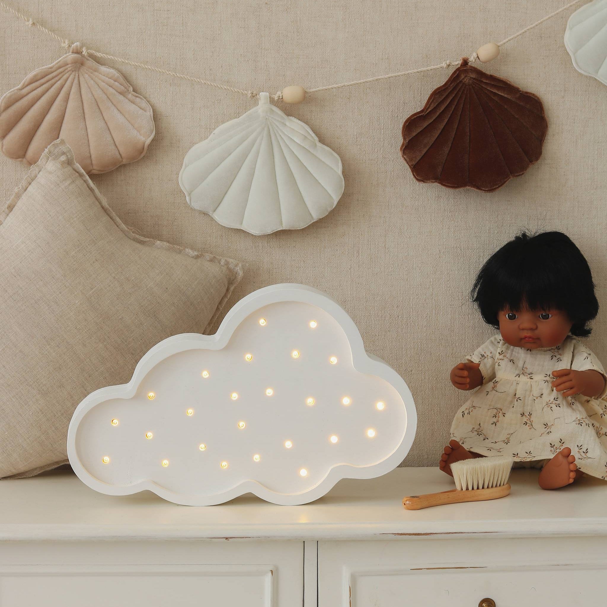 Little Lights Cloud Lamp White on a dresser next to a doll in a girl's room