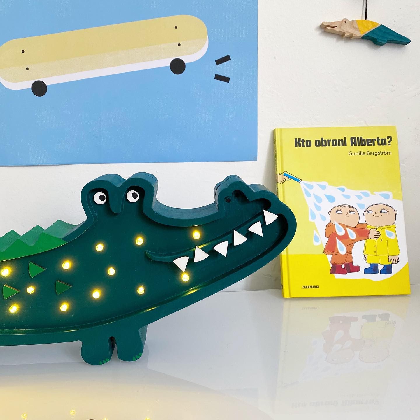 Little Lights Crocodile Lamp on a dresser in a kid's room