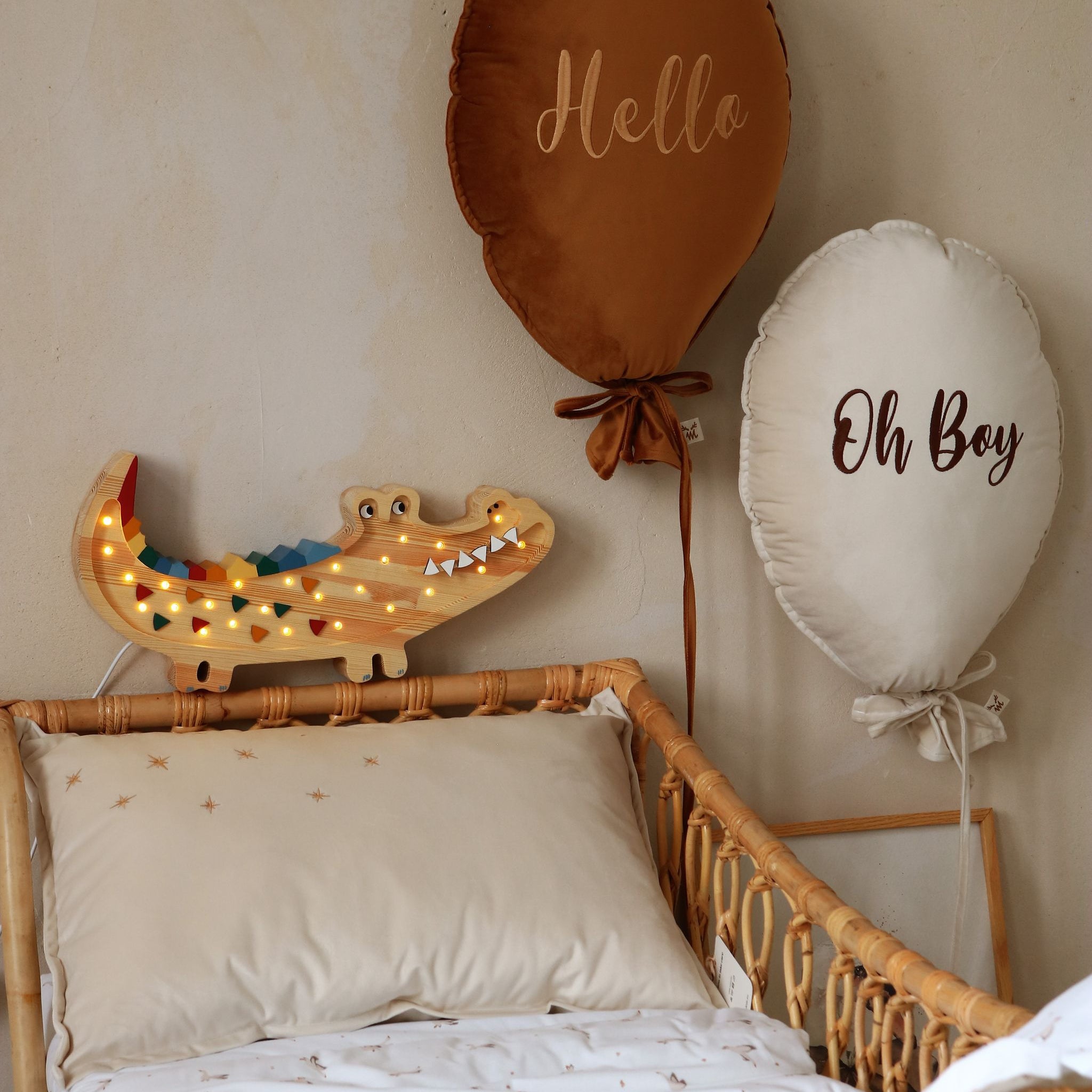Little Light Crocodile Wooden lamp next to a bed in a boy's room