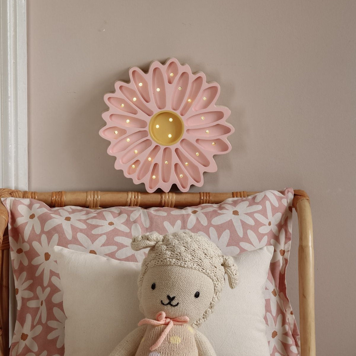 Little Lights Daisy Flower Pink Lamp next to a bed in a girl's room