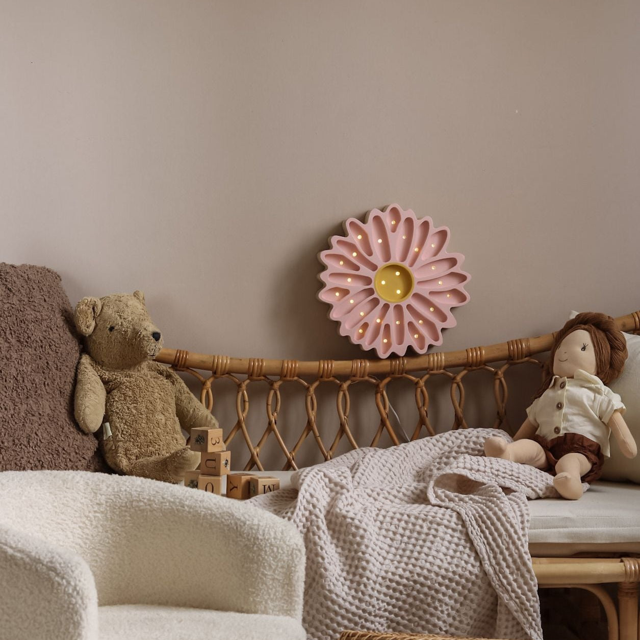 Little Lights Pink Daisy Flower Lamp glowing in a baby girl room