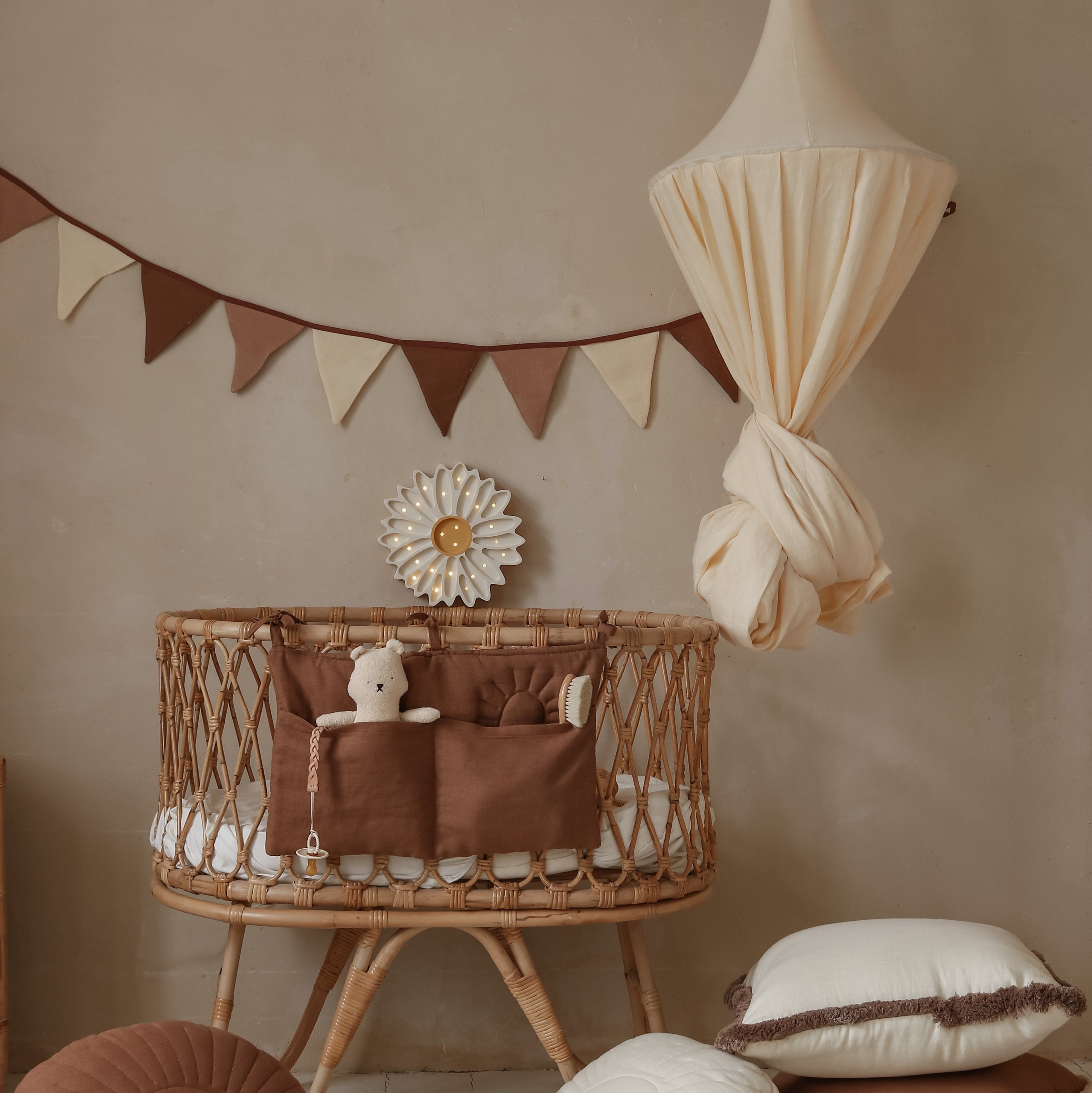 Little Lights White Daisy Lamp next to a baby crib in a nursery
