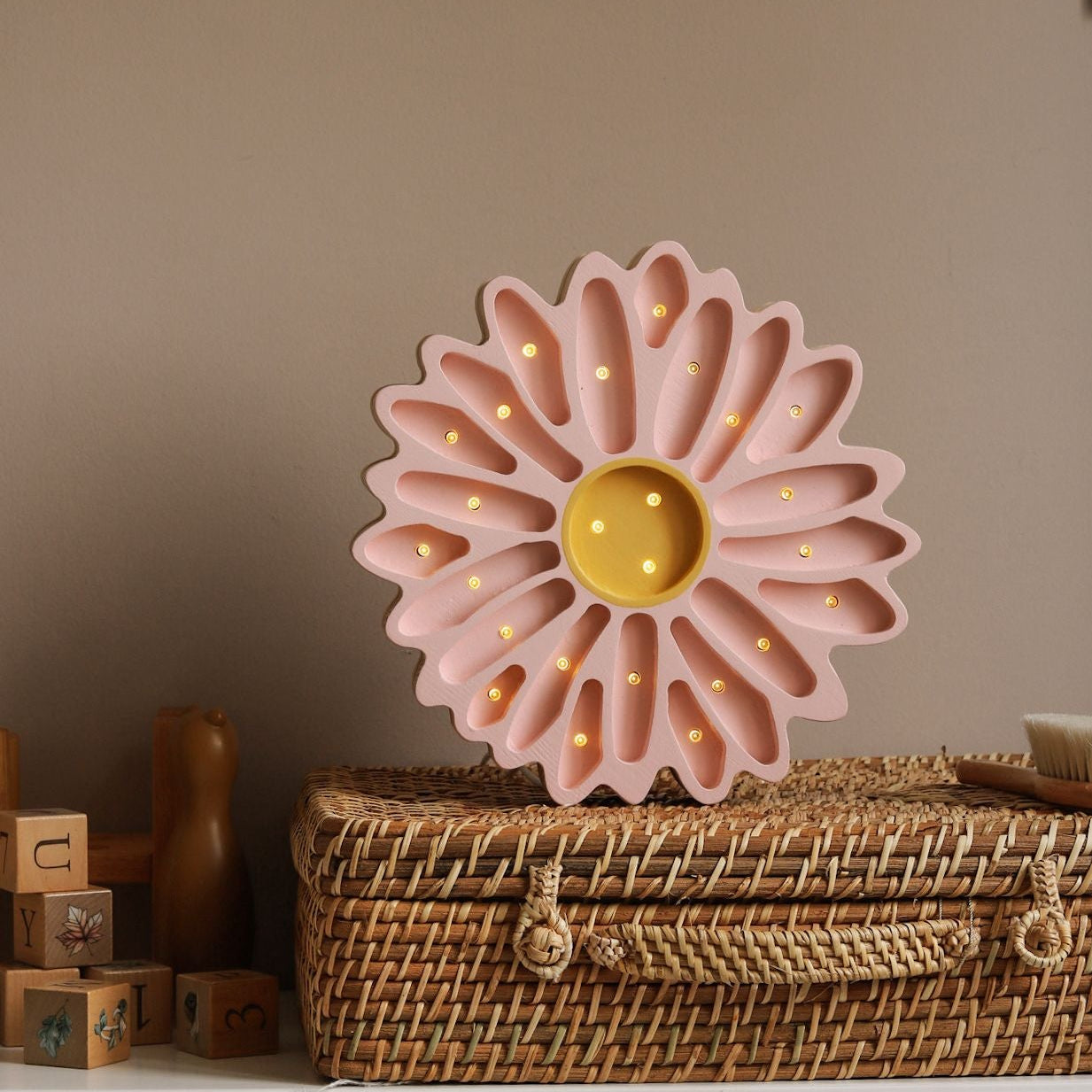 Little Lights Daisy Flower Lamp Powder Pink on a dresser in a girl's room