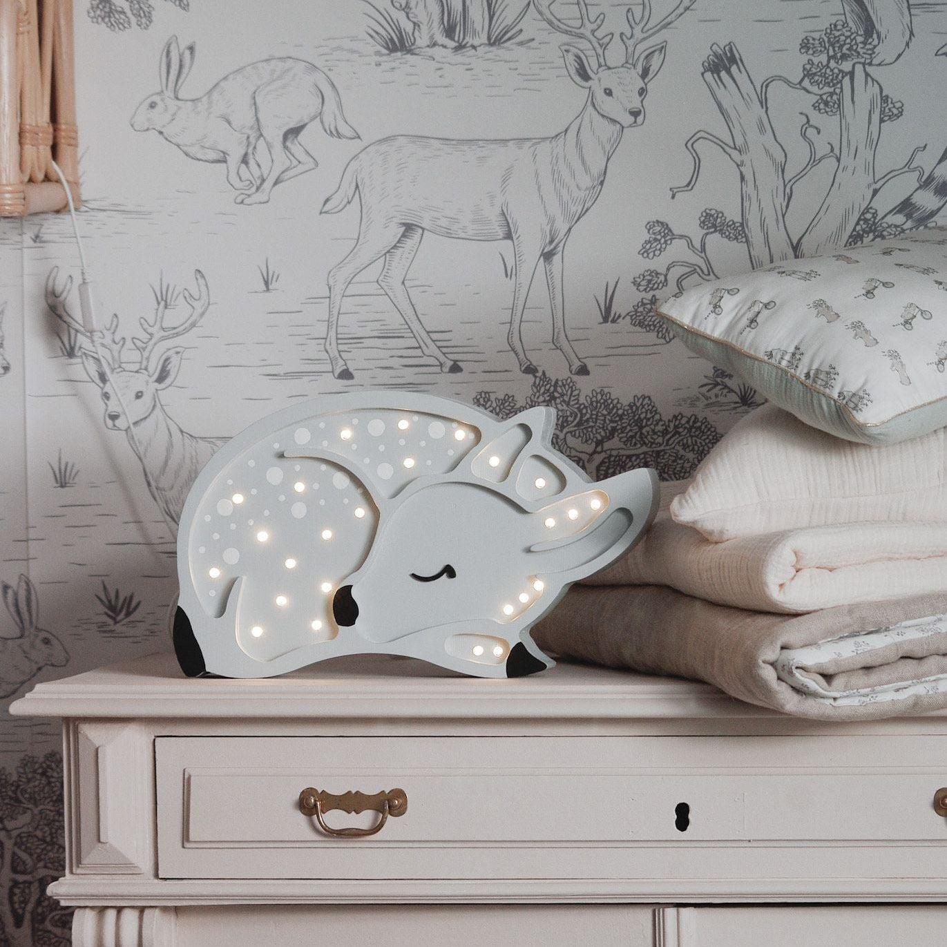 Little Lights Grey Deer Lamp on a dresser in a boy's room
