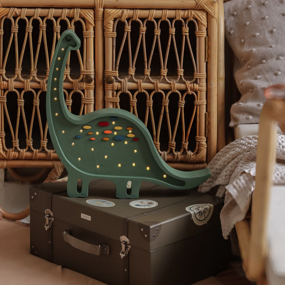 Kid's room with wicker furniture and wooden Little Lights Dino Diplodocus green night light