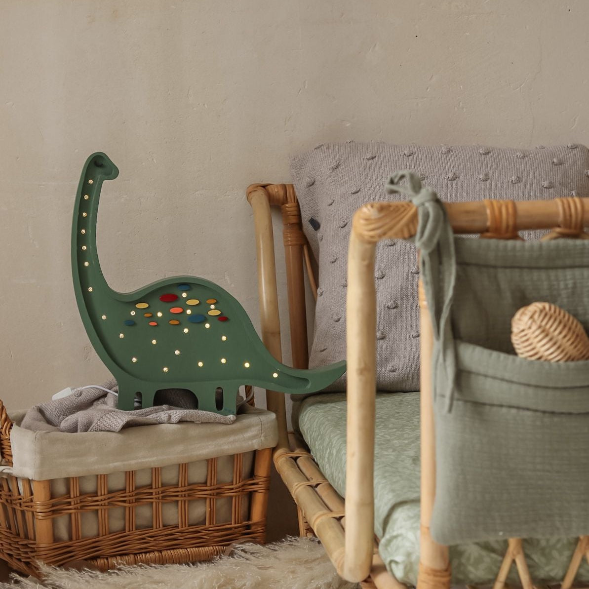 Children's room with a green Little Lights Dino Diplodocus Lamp by the bed
