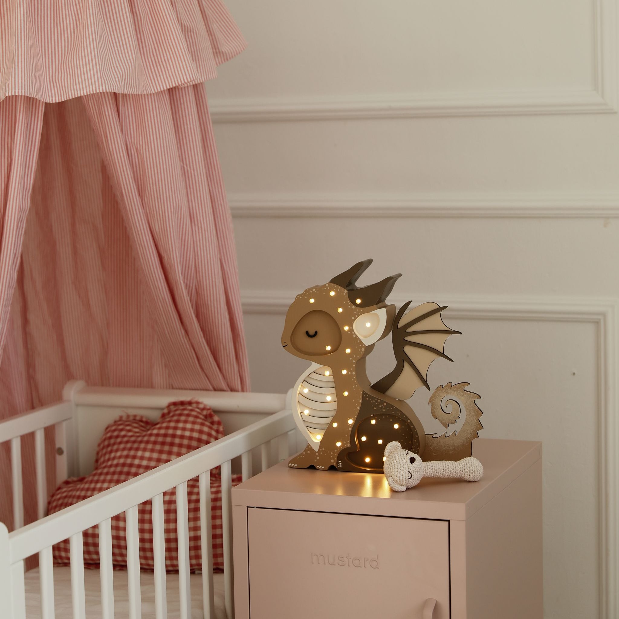Little Lights Brown Baby Dragon night light in a baby girl nursery