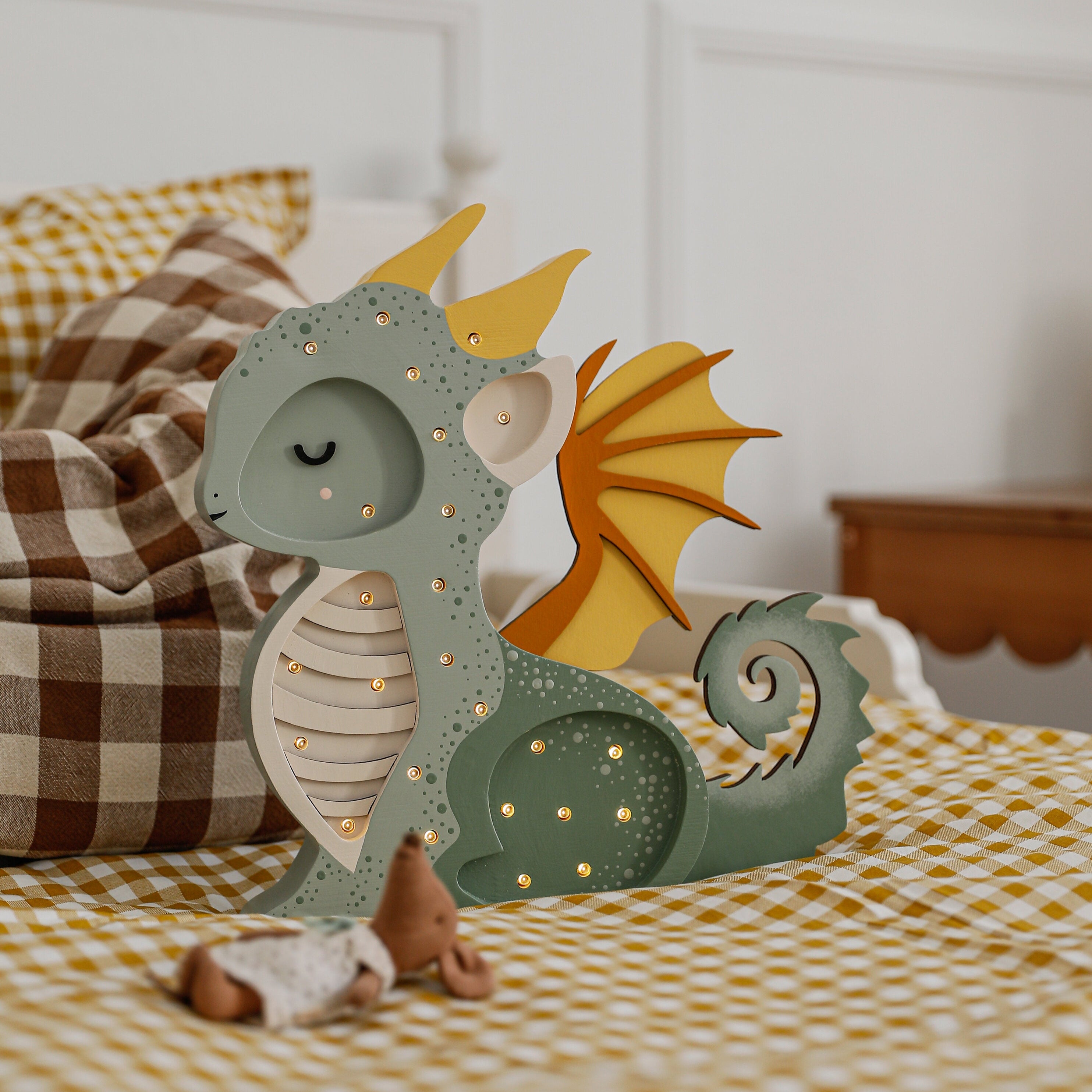Little Lights Dragon Lamp glowing in hunter green – perfect newborn gift