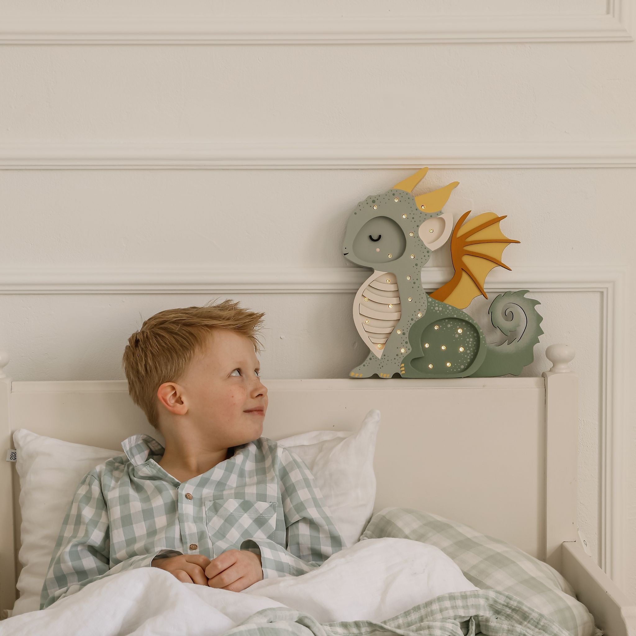 Little Lights Dragon Lamp Green next to bed in boy's room