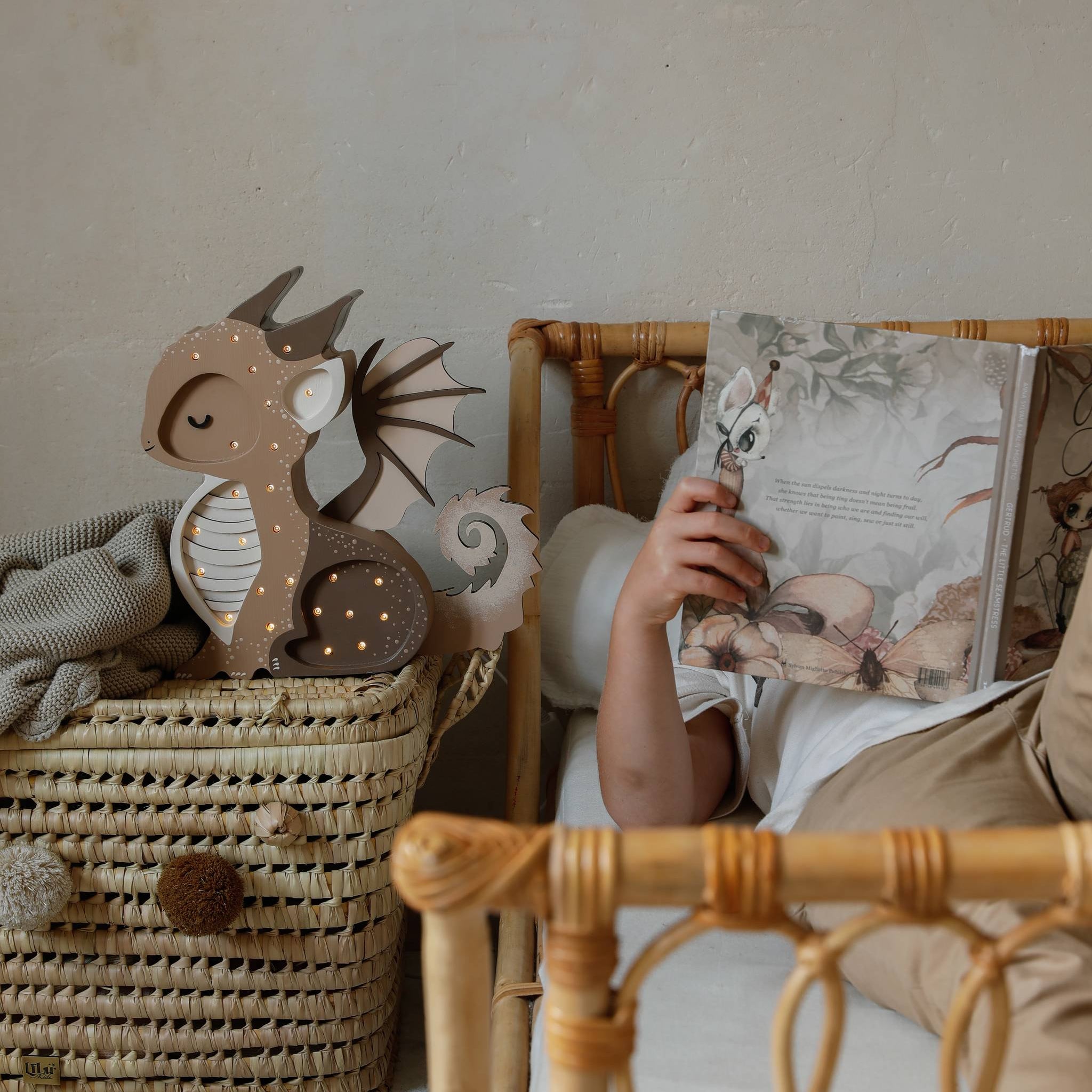Little Lights Dragon Lamp Brown in a boy's room by the bed