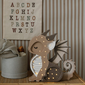 Decorative Dragon Lamp on a wicker shelf in baby nursery