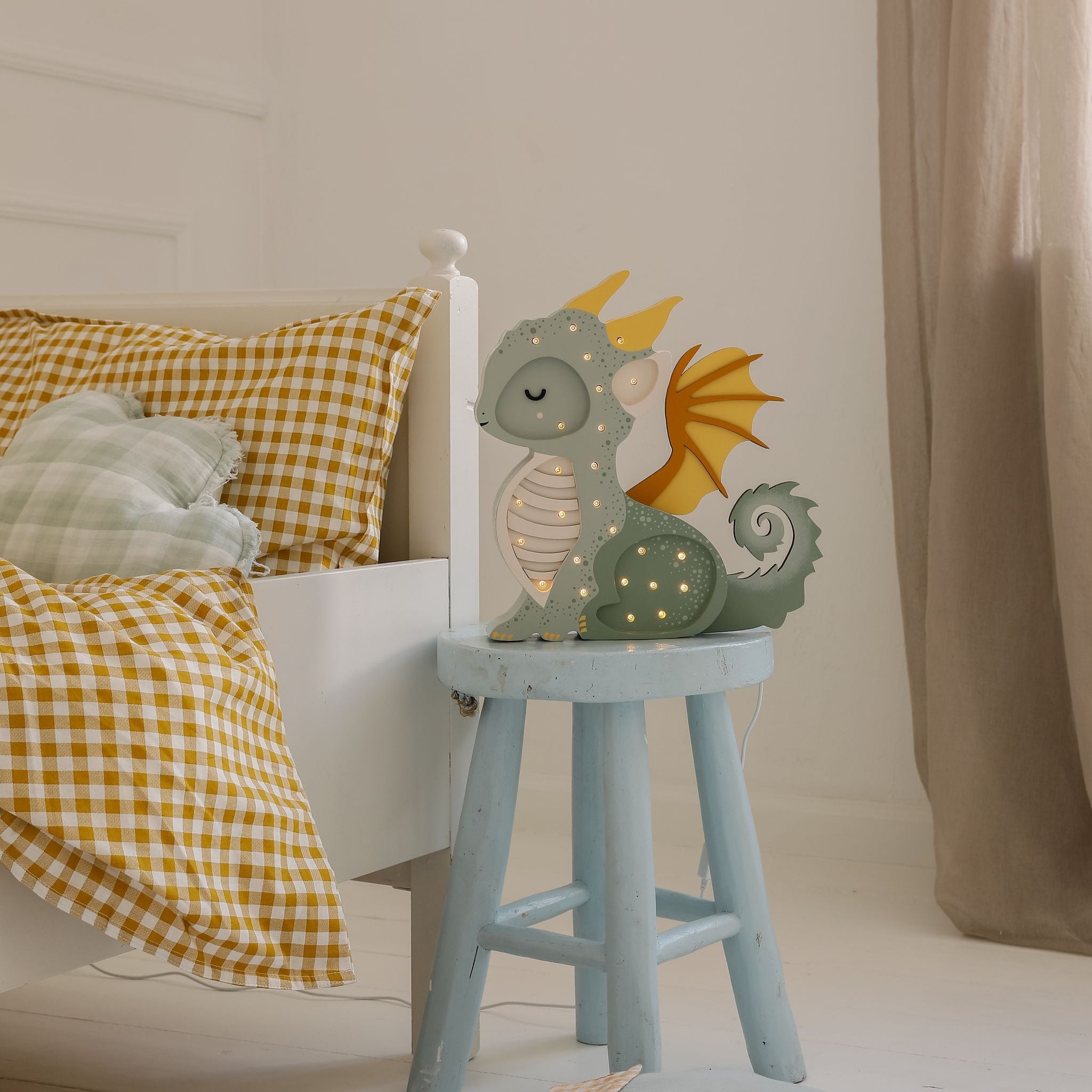 Little Lights Green Dragon Lamp by kid's bed