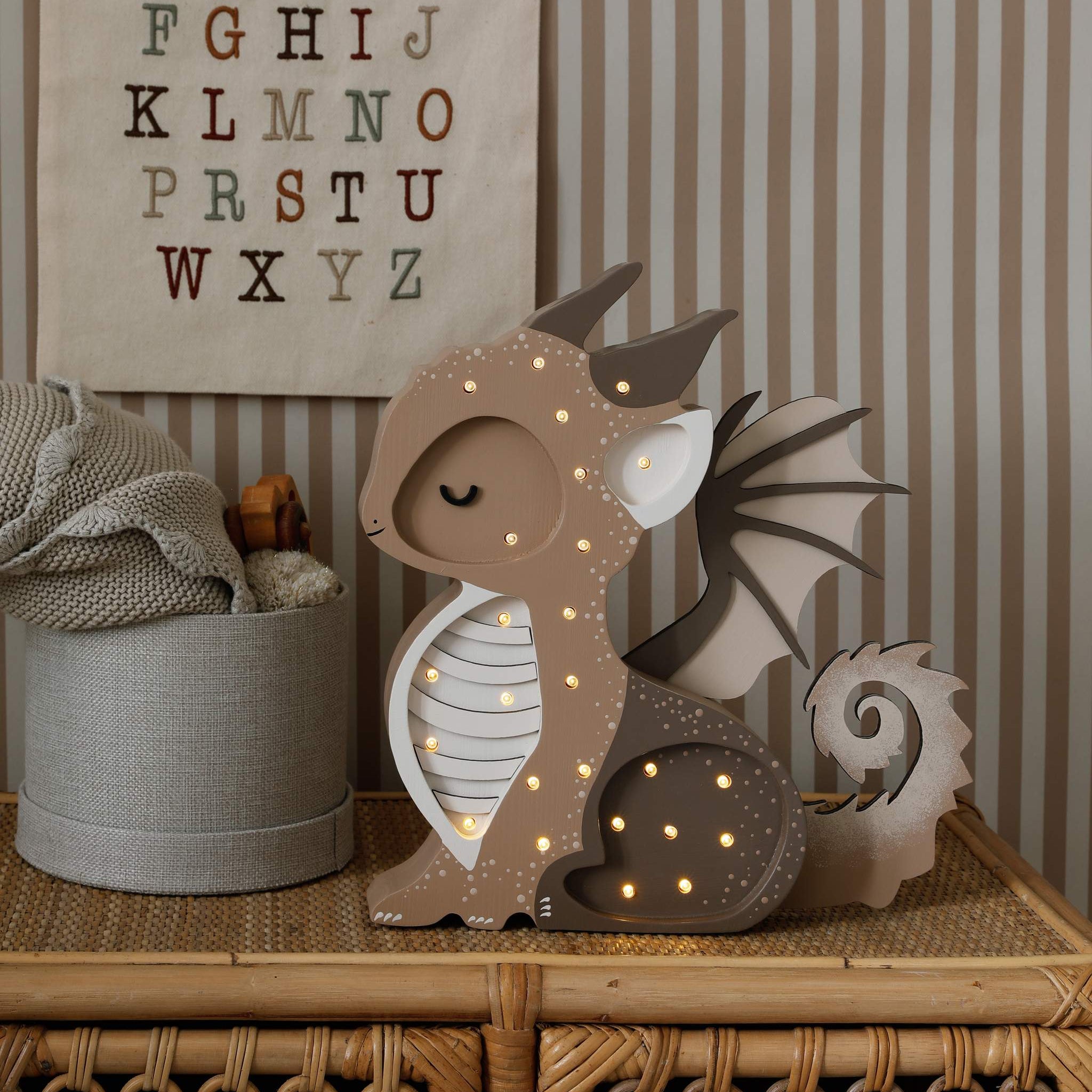 Little Lights Baby Dragon Night light on a dresser in a kid's room