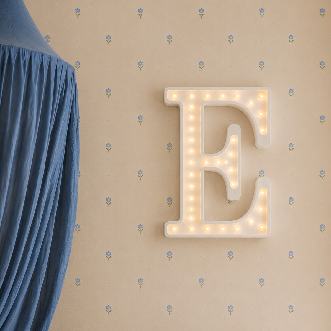Little Lights Wooden Custom Made E Night Light glowing on the wall in a boy's nursery