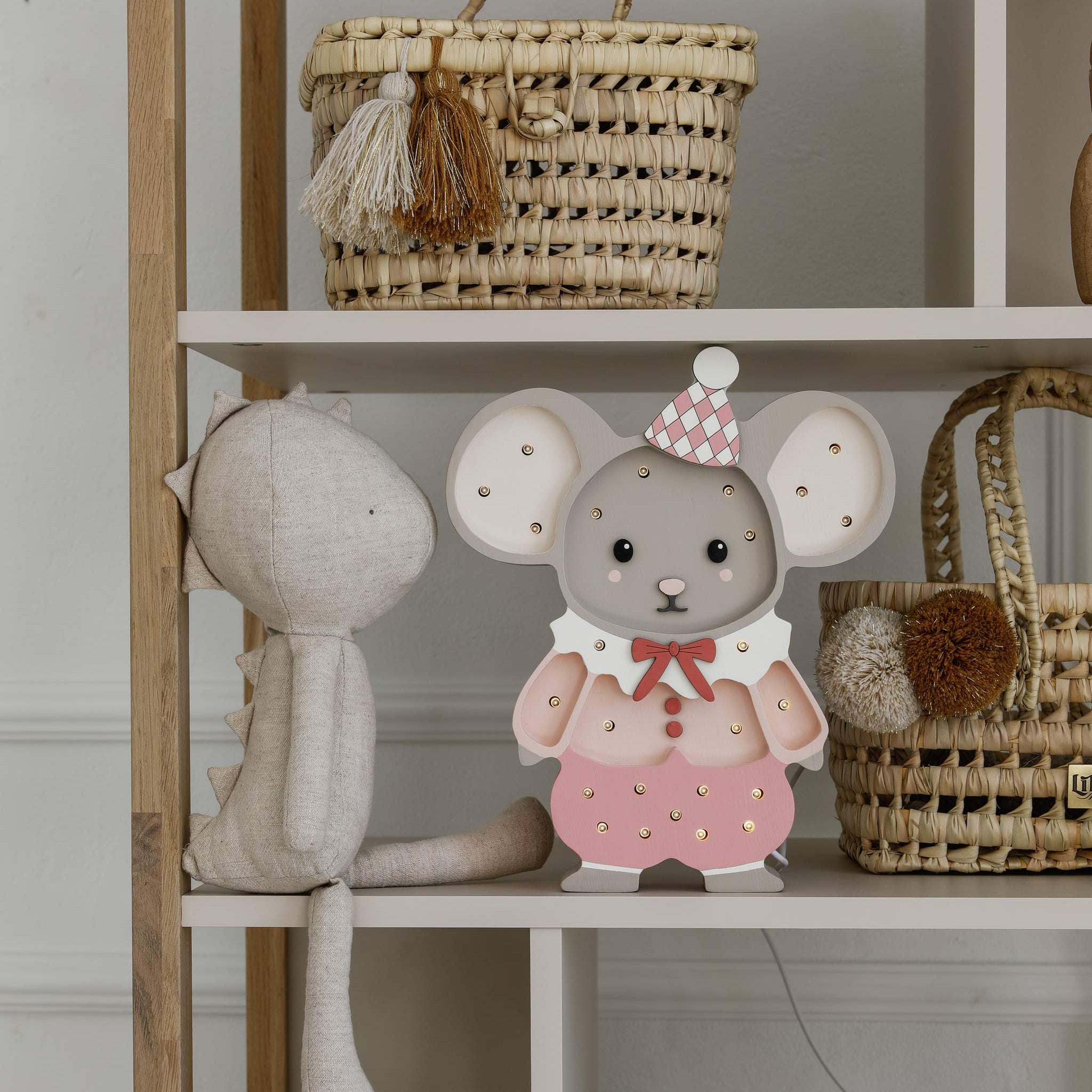 Little Lights Felix the Mouse Pink night light on a shelf in a kid's room