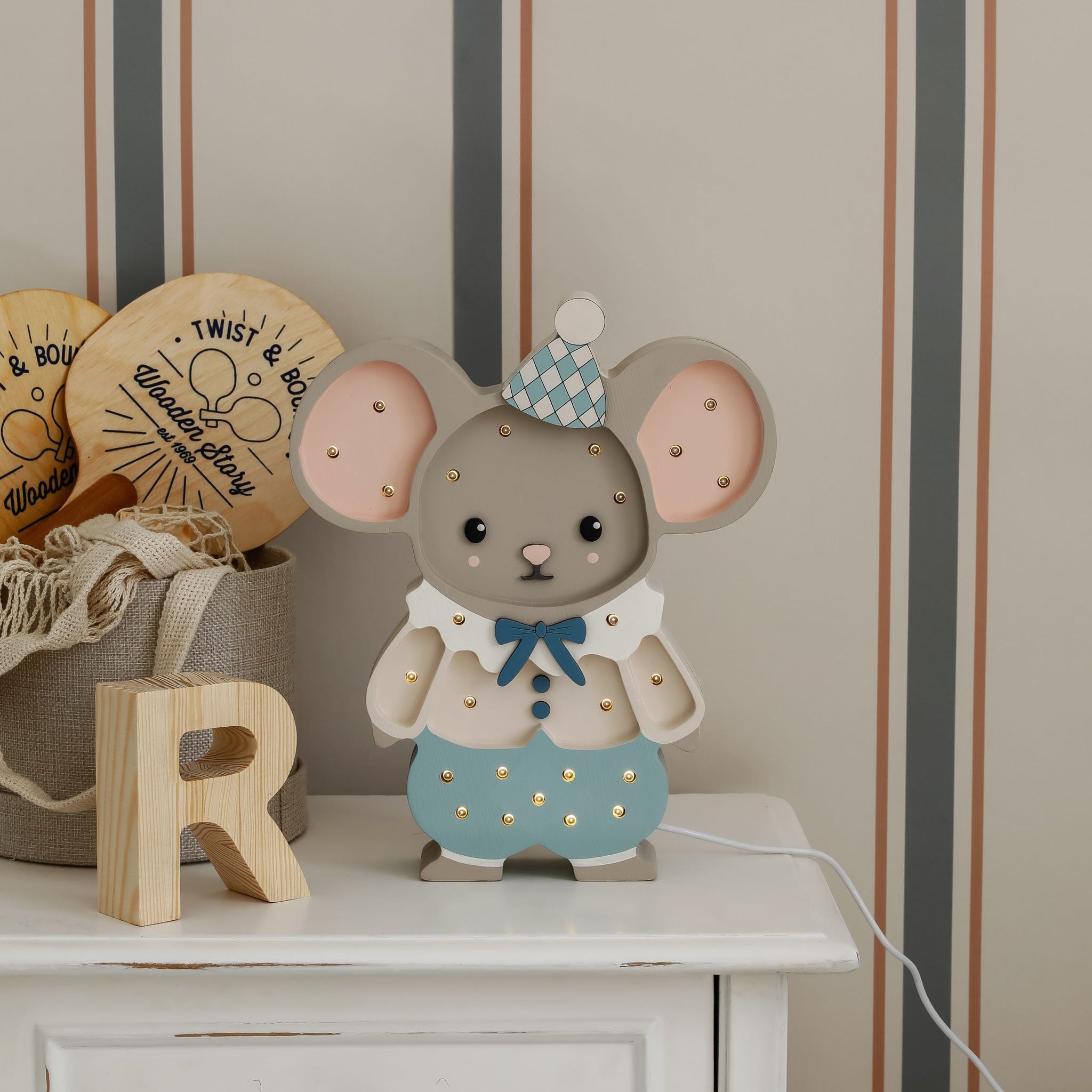 Little Lights Felix the Mouse blue on the dresser in a kid's room