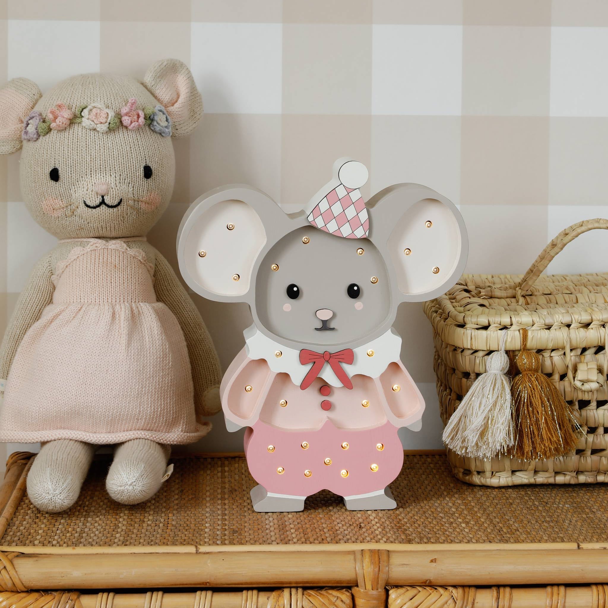 Little Lights Pink Felix the Mouse lamp on a dresser in a girl's nursery