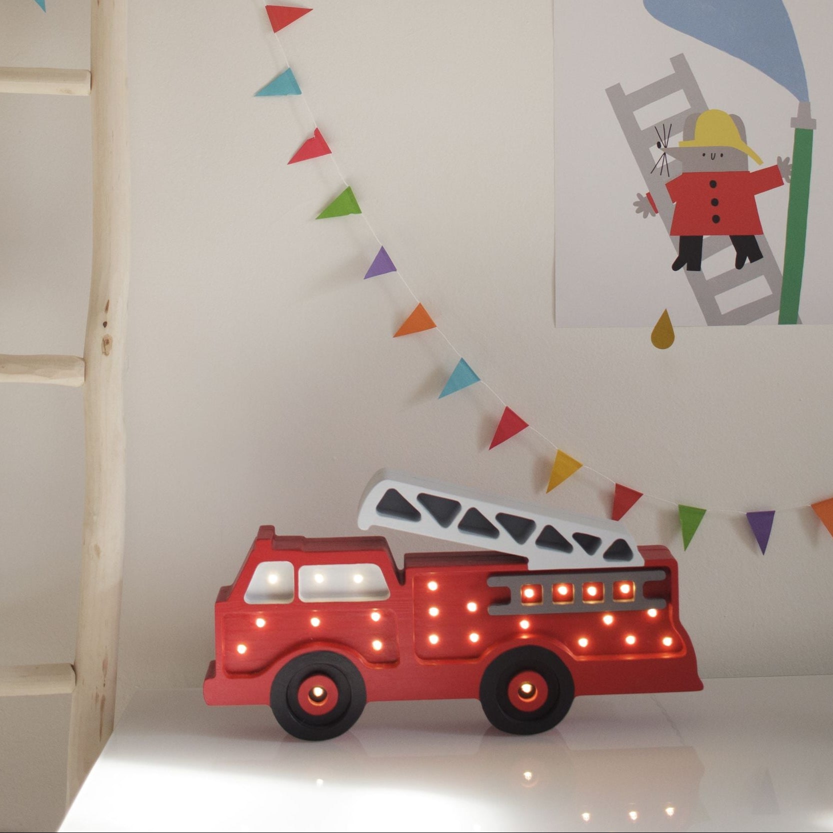 Little Lights red Fire Truck Lamp on a dresser in a kid's room