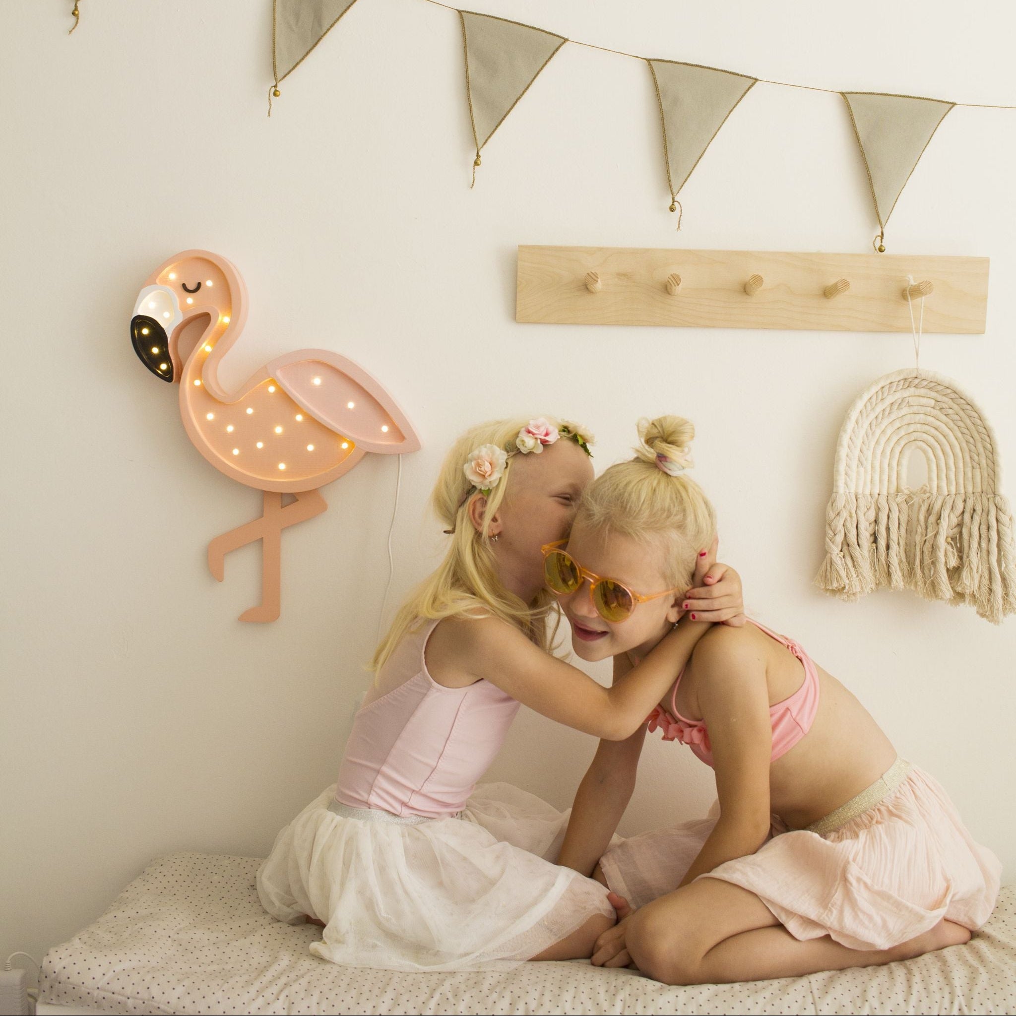 Little Lights Flamingo Night Light glowing softly in a girl's room