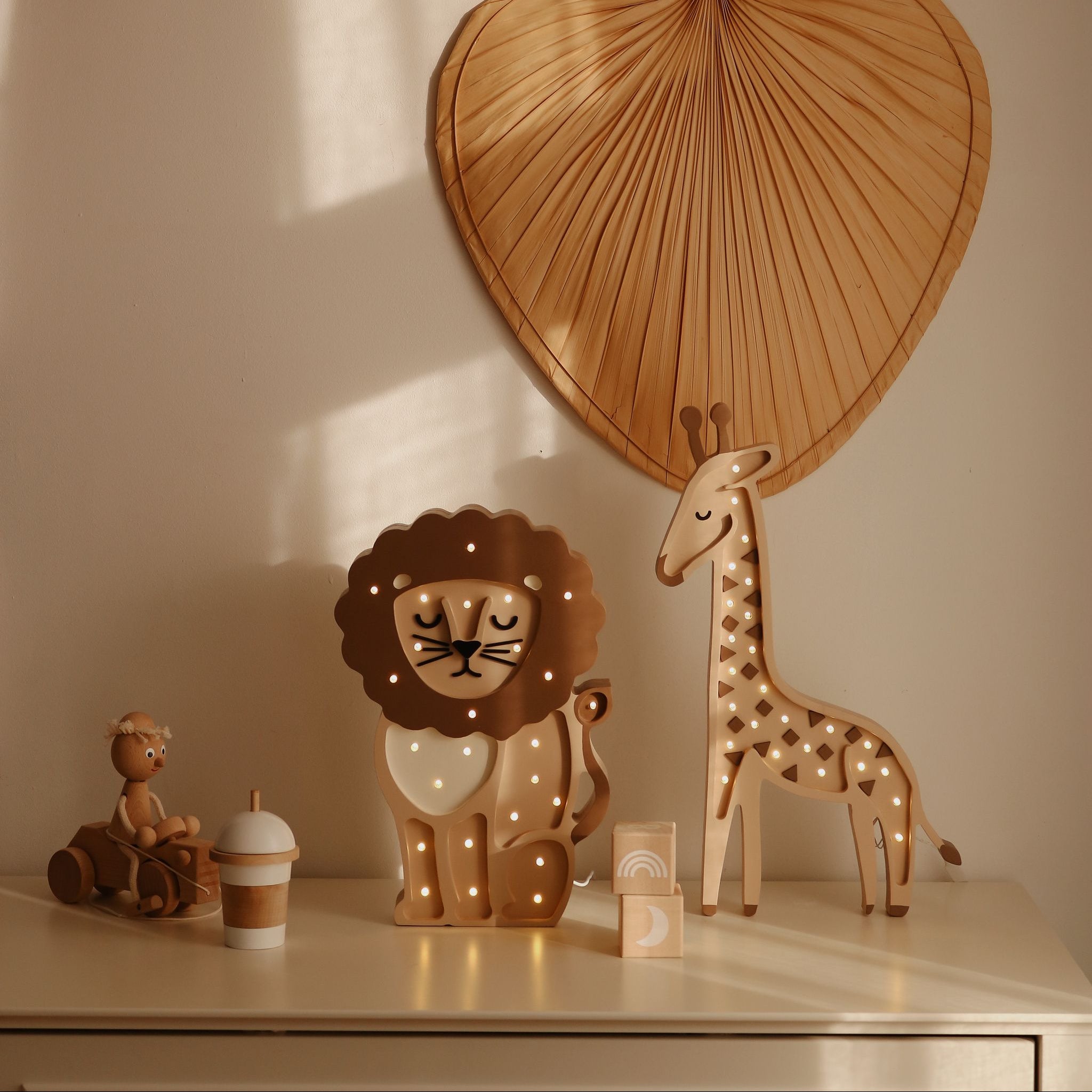 Little Lights Giraffe beige night light on a dresser in a baby nursery