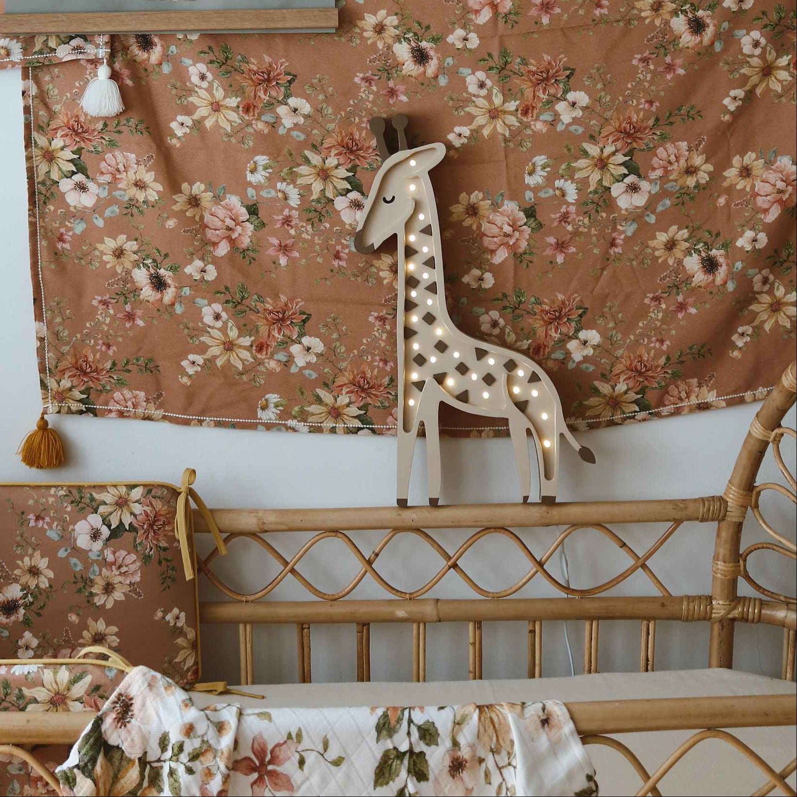 Little Lights beige Giraffe Lamp by the bed in a baby nursery