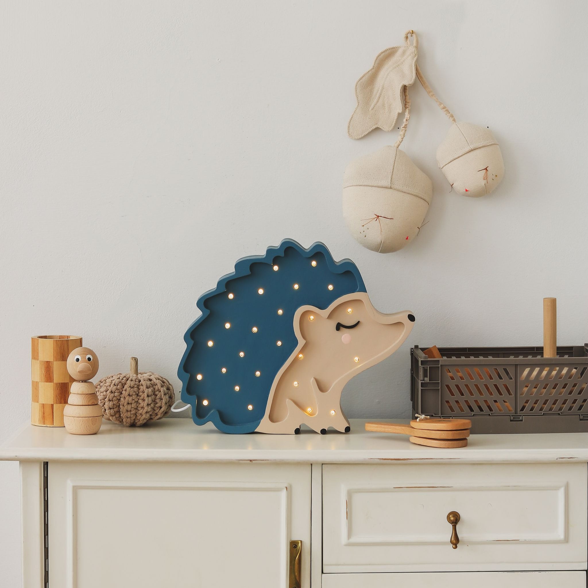 Little Lights blue Hedgehog Lamp on a dresser in a. baby nursery