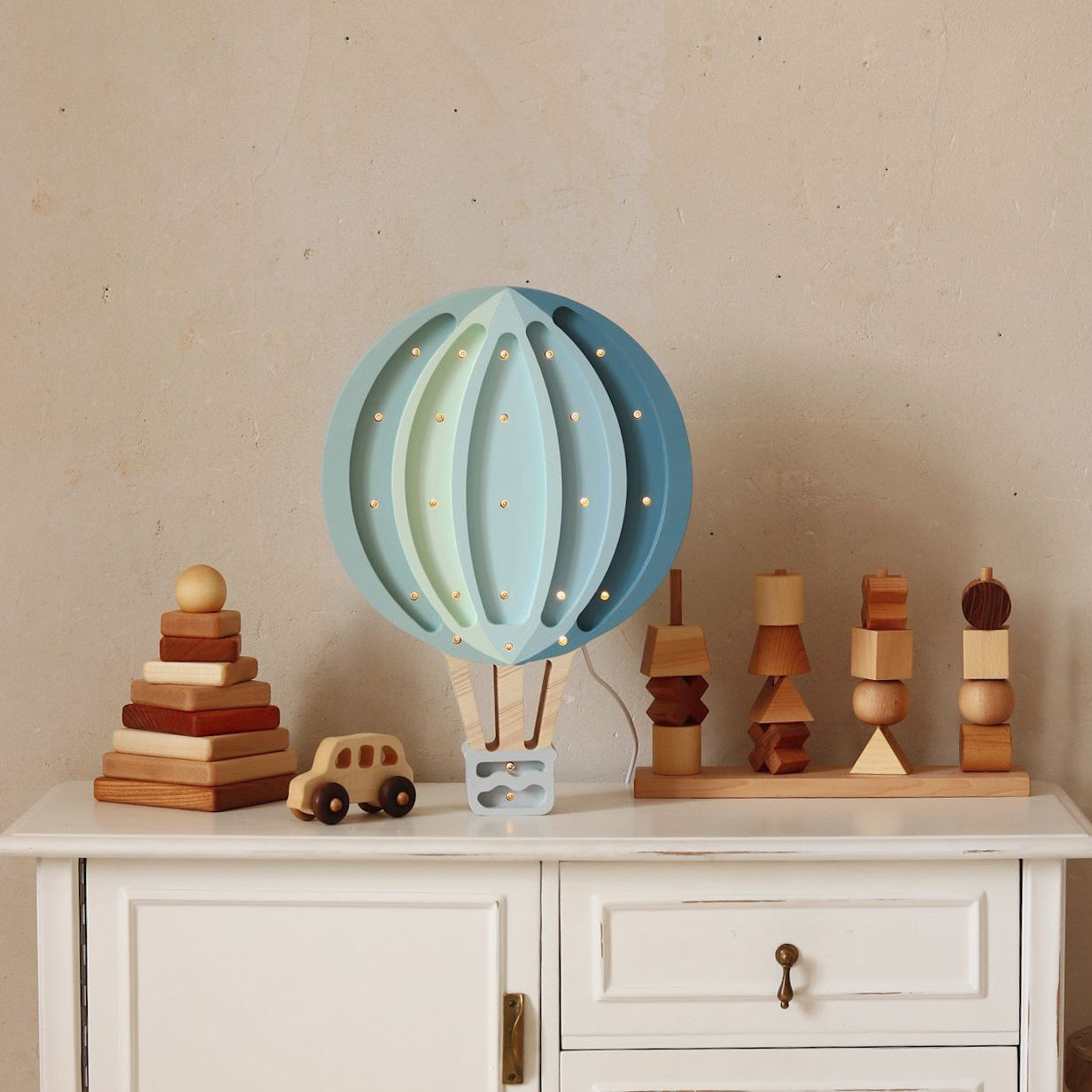 Little Lights blue Hot Air Balloon on a dresser in a baby nursery