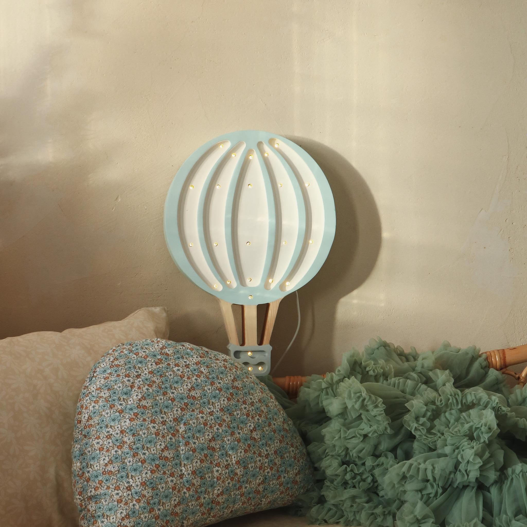 Hot Air Balloon blue night light by the bed in a baby girl nursery