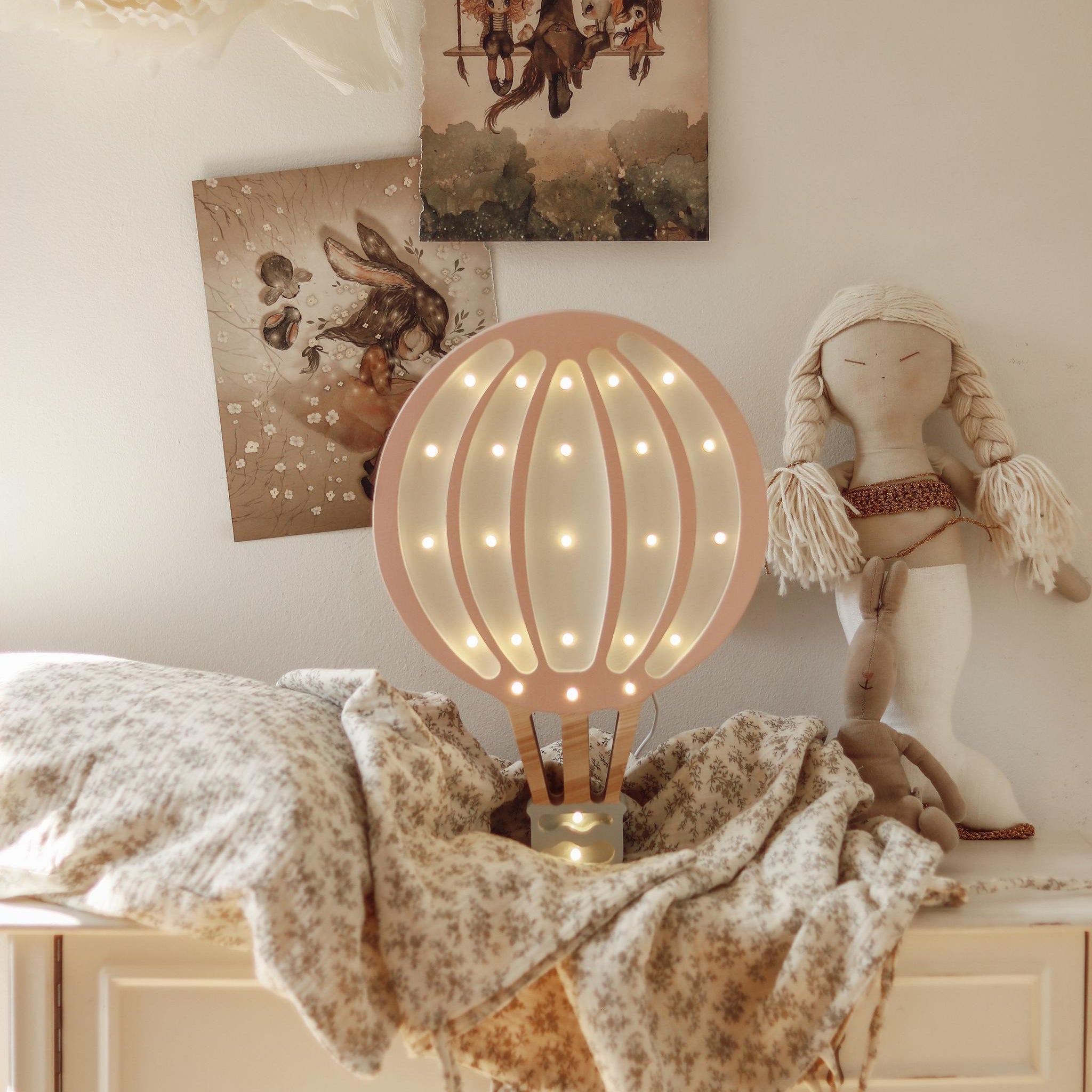 Little Lights pink Hot Air Balloon on a dresser in a baby nursery