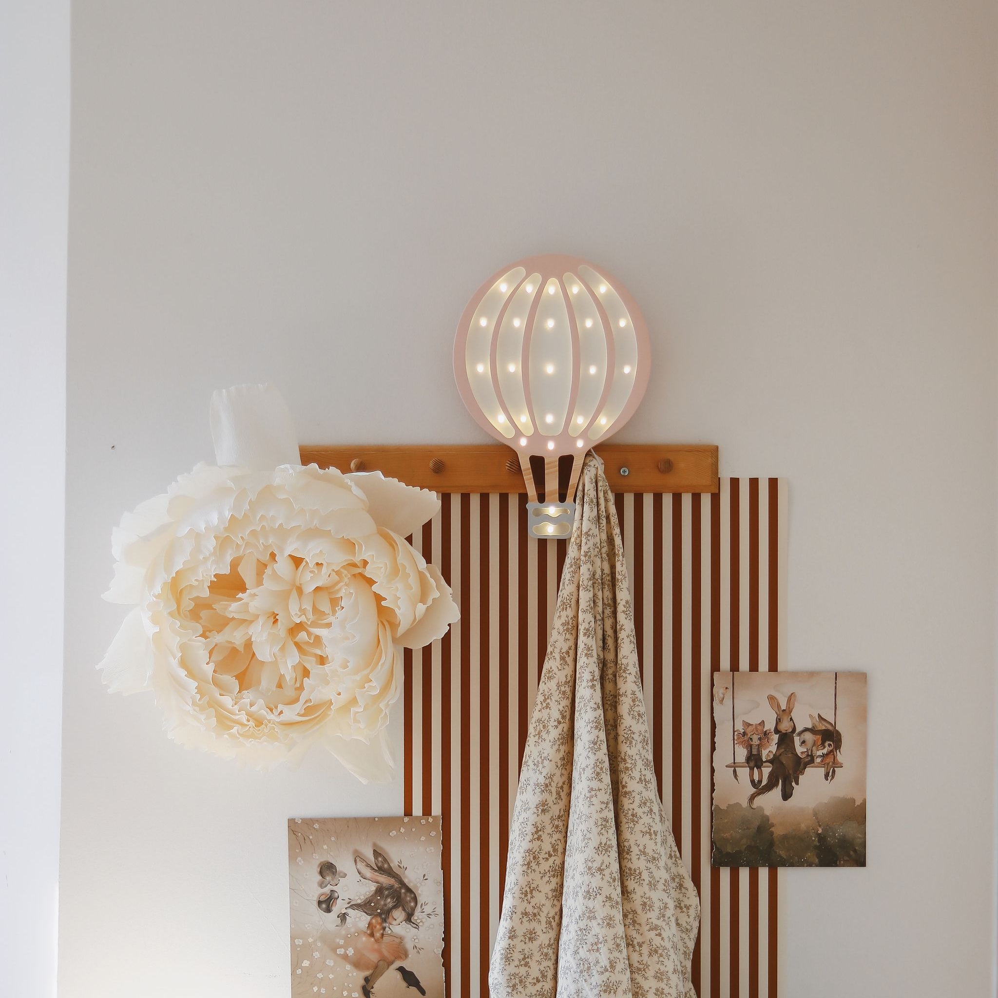 Little Lights Hot Air Balloon Powder Pink hung on the wall in a baby girl room