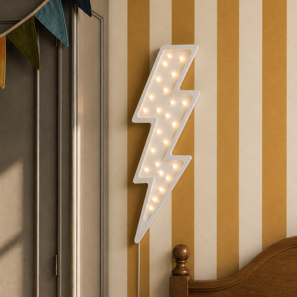 Little Lights whote Lightning Bolt Lamp hanging on the wall in a boy's bedroom