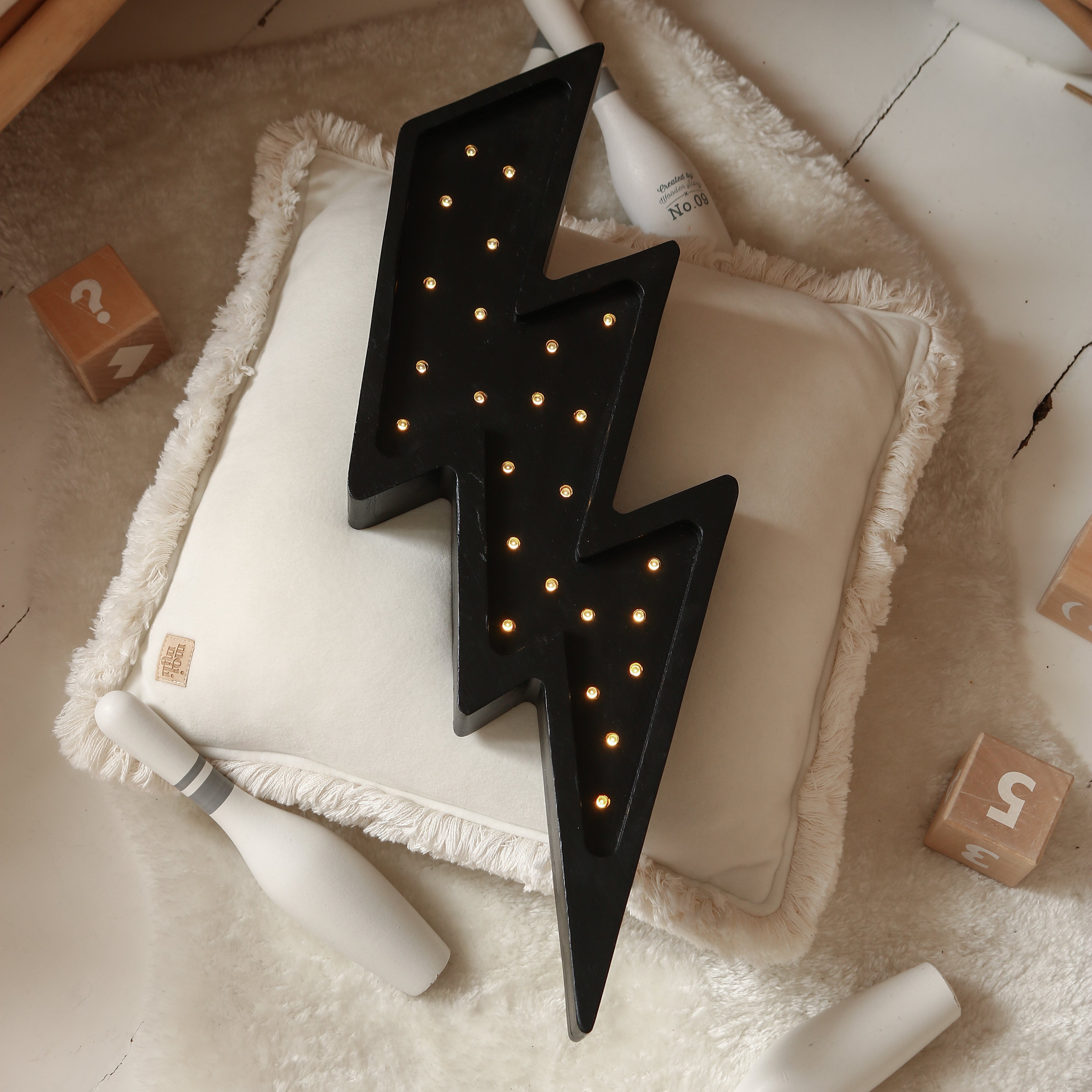 Little Lights black Bolt night light in a baby room