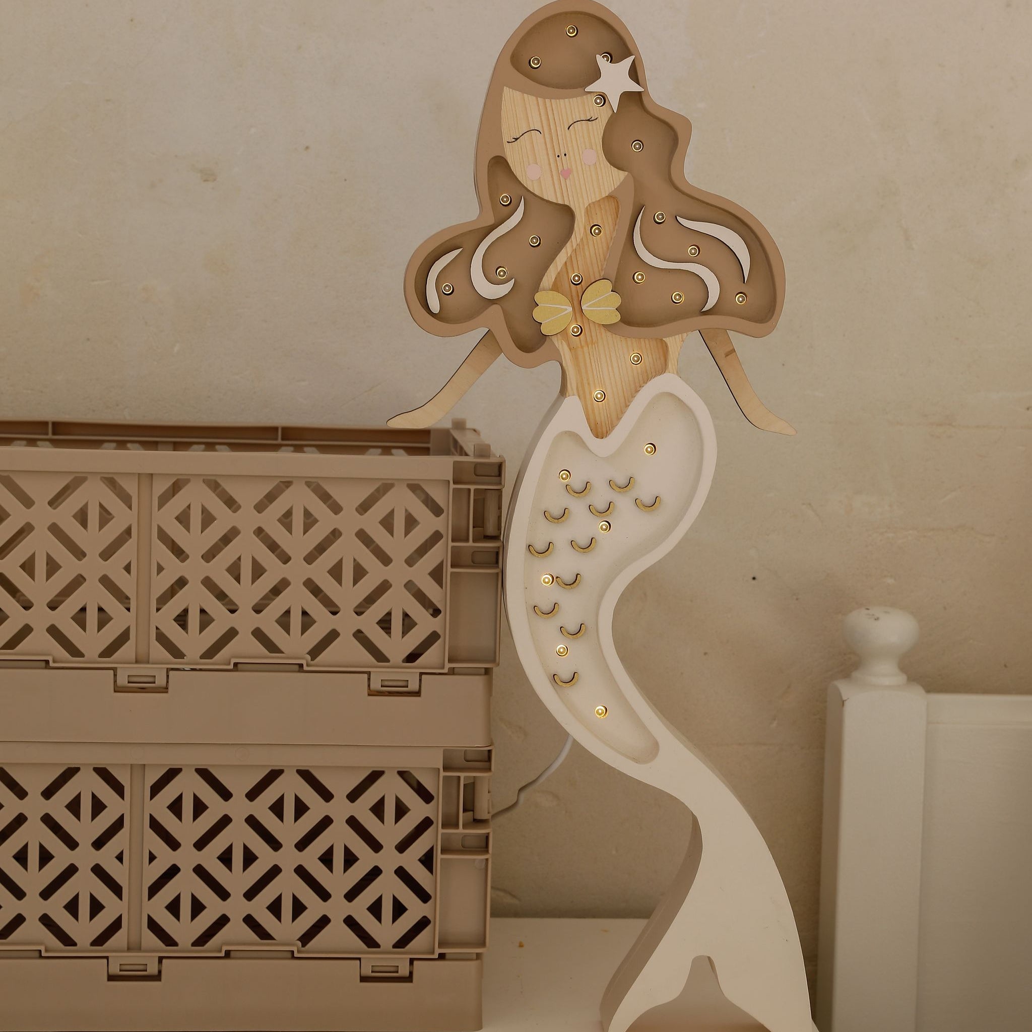 Beige Wooden Mermaid Lamp by the child's bed