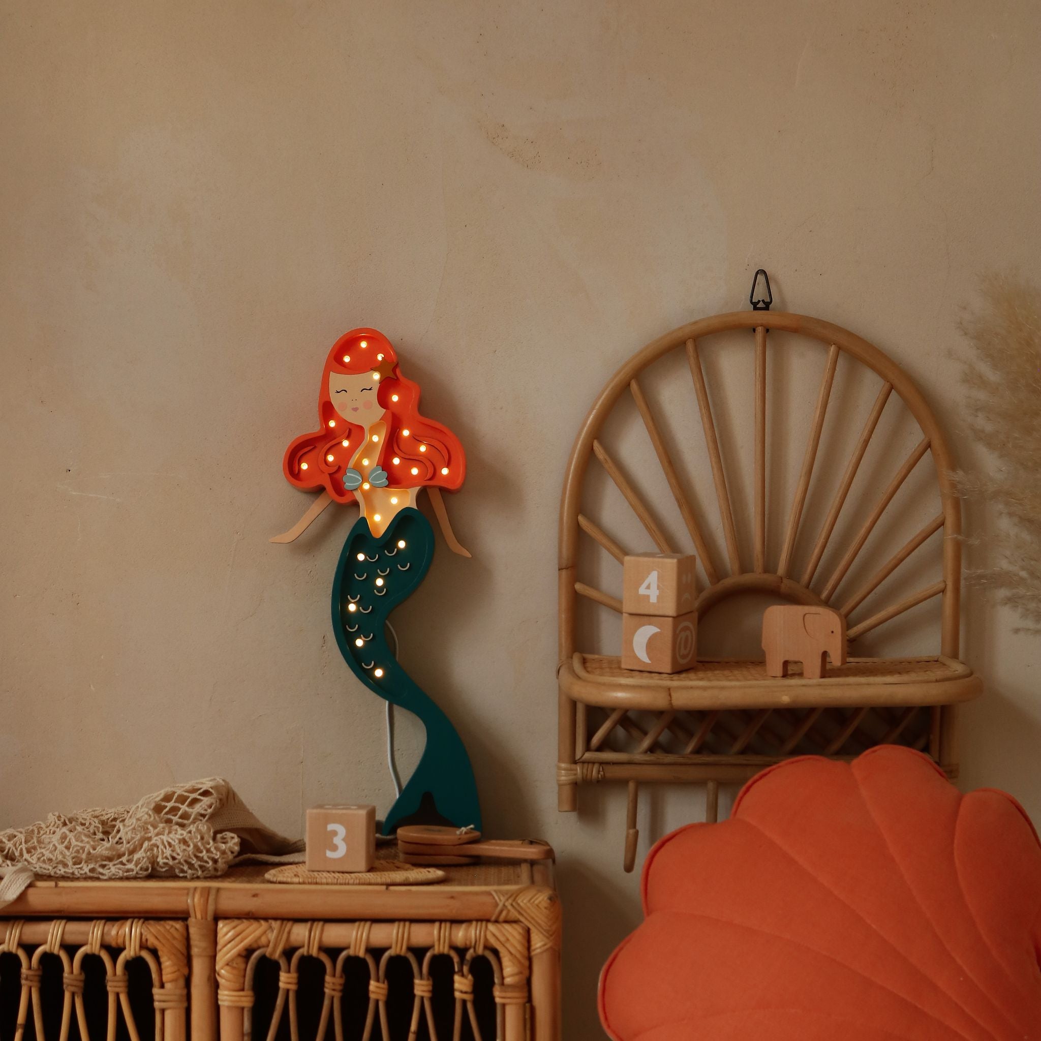 Little Lights ginger Mermaid Lamp glowing in a girl's nautical room